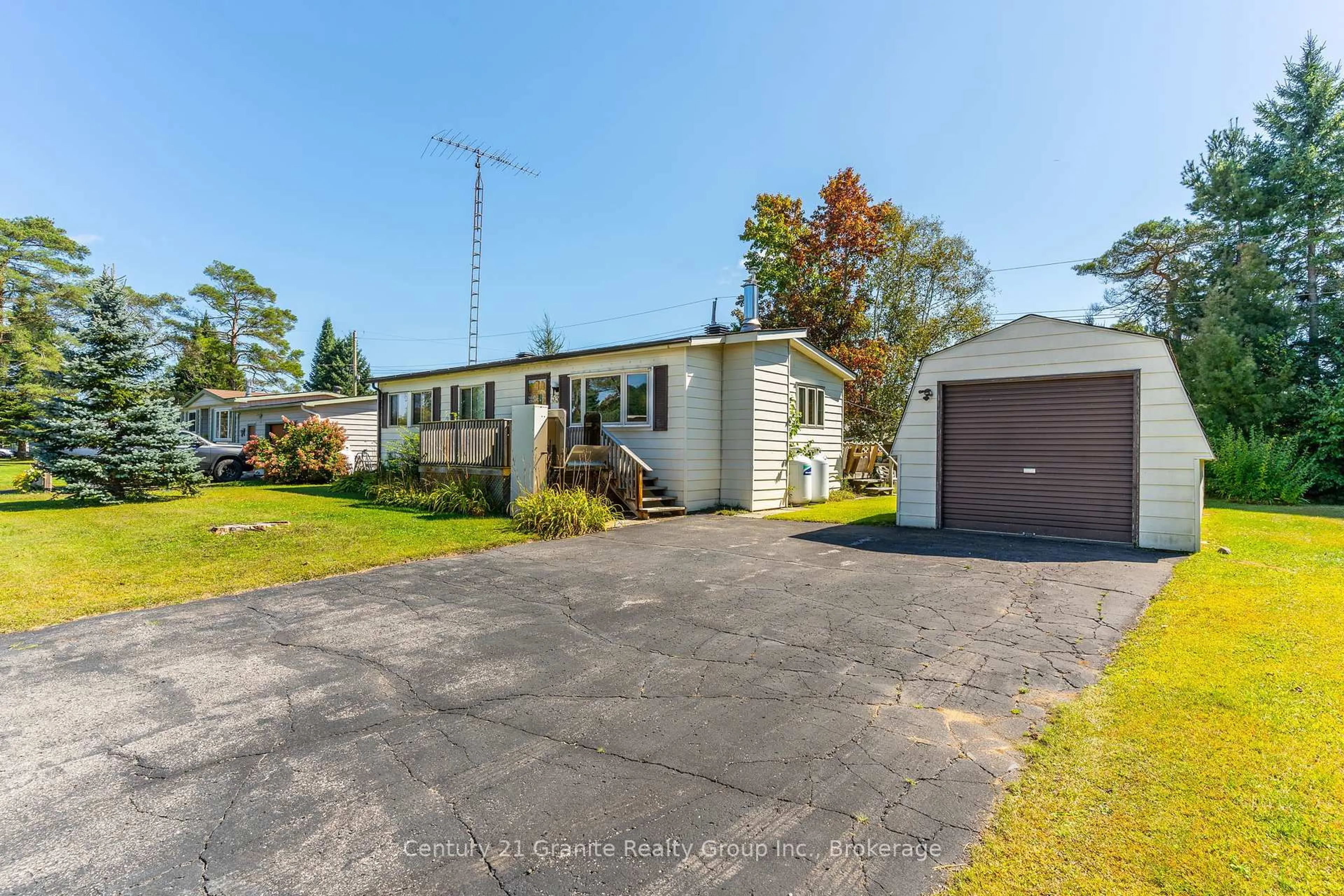 A pic from outside/outdoor area/front of a property/back of a property/a pic from drone, street for 1034 EIGHTH Lane, Minden Hills Ontario K0M 2K0