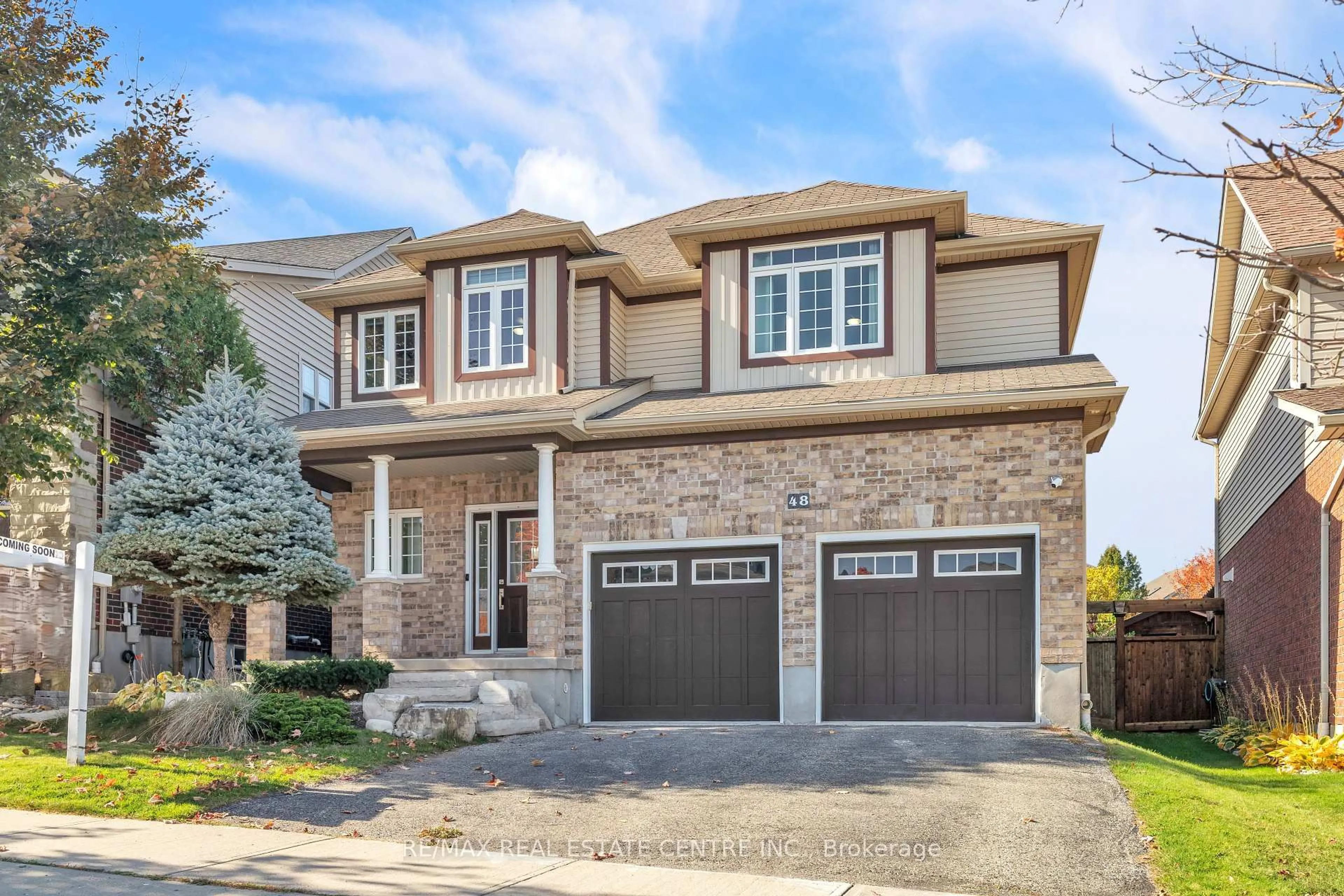 Home with brick exterior material, street for 48 Isaiah Dr, Kitchener Ontario N2E 0B2
