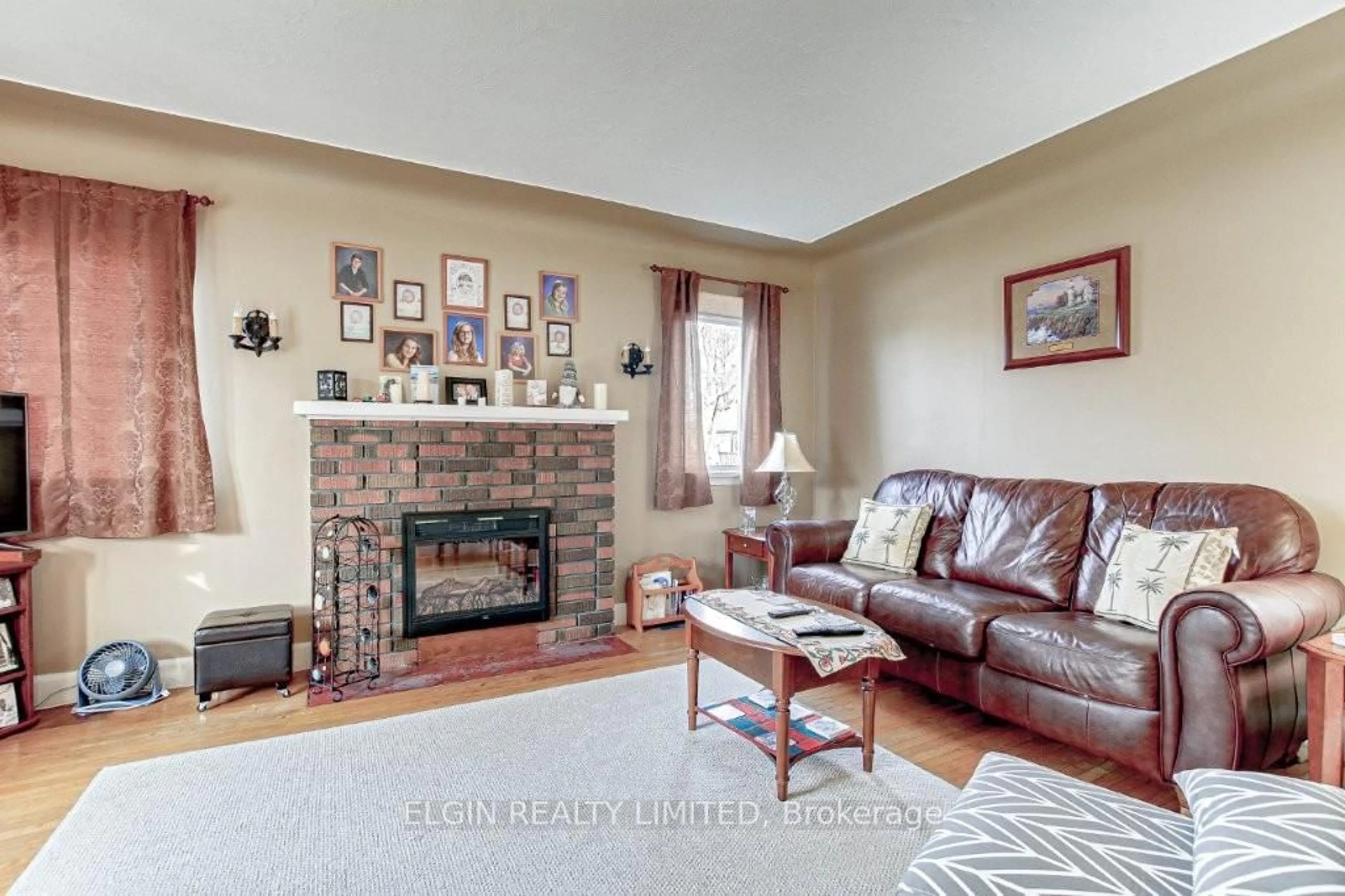 Living room with furniture, ceramic/tile floor for 128 Myrtle St, St. Thomas Ontario N5R 2G5