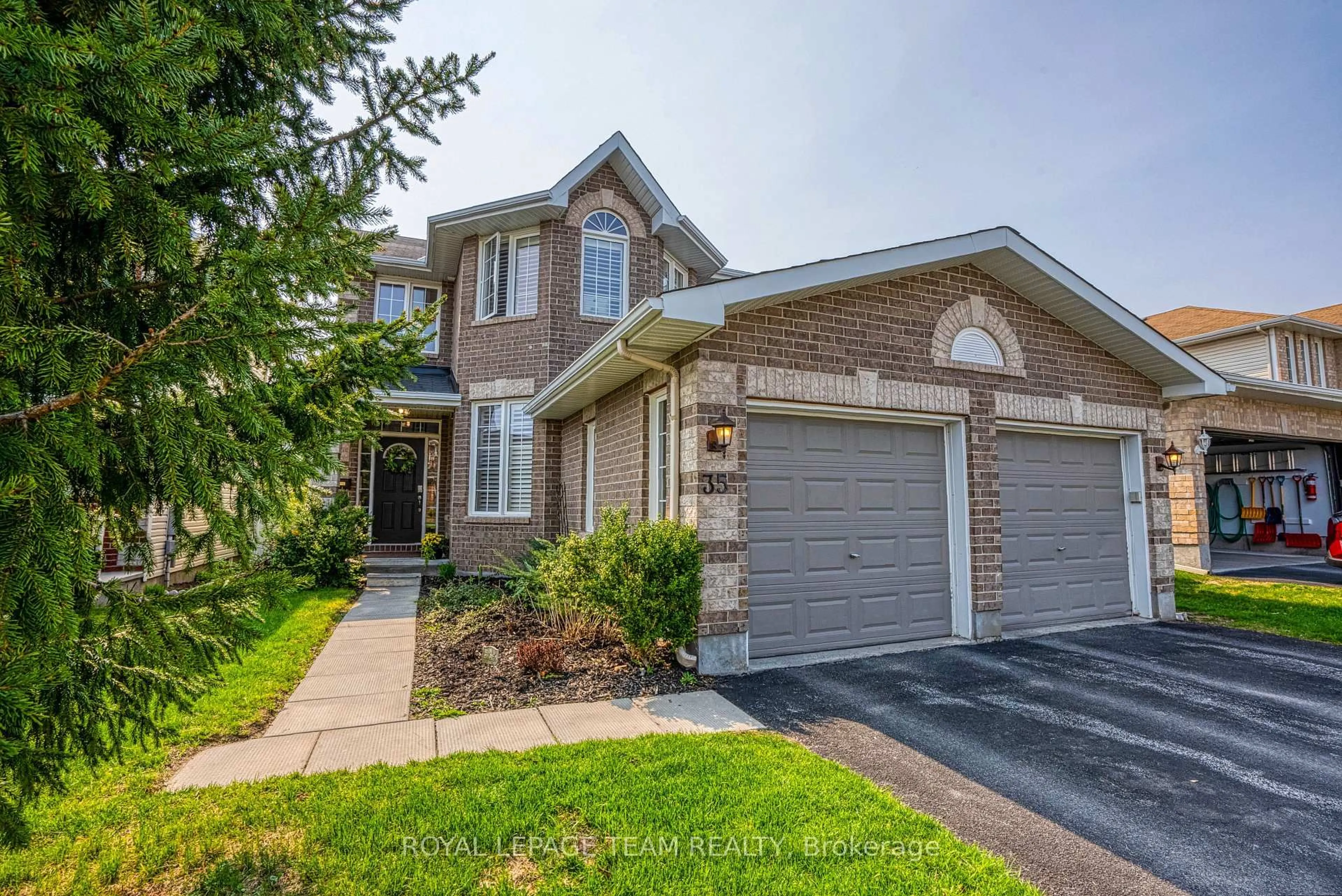 Home with brick exterior material, street for 35 Woliston Cres, Kanata Ontario K2W 1G3