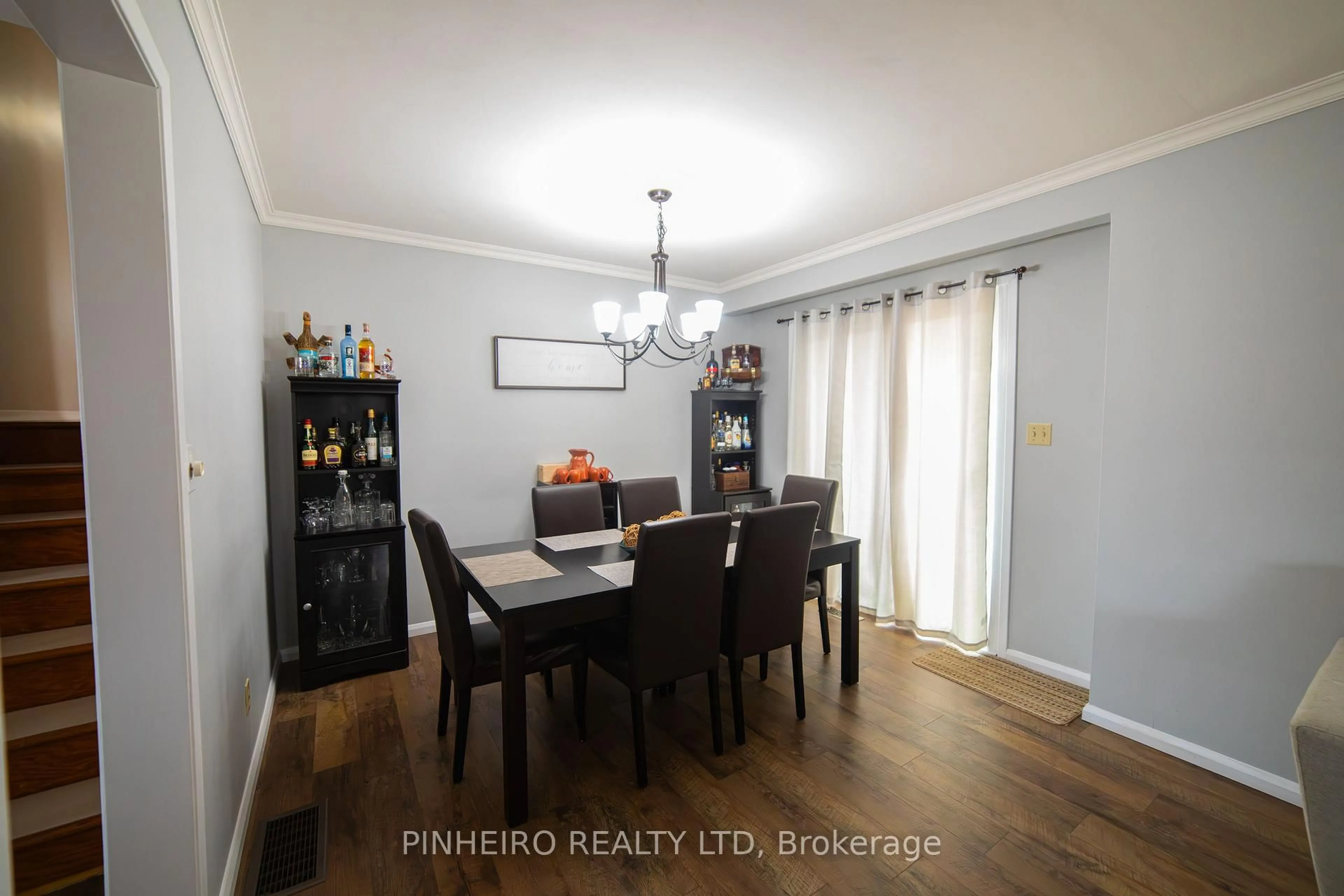 Dining room, wood/laminate floor for 7 McLarty Dr, St. Thomas Ontario N5R 5J7