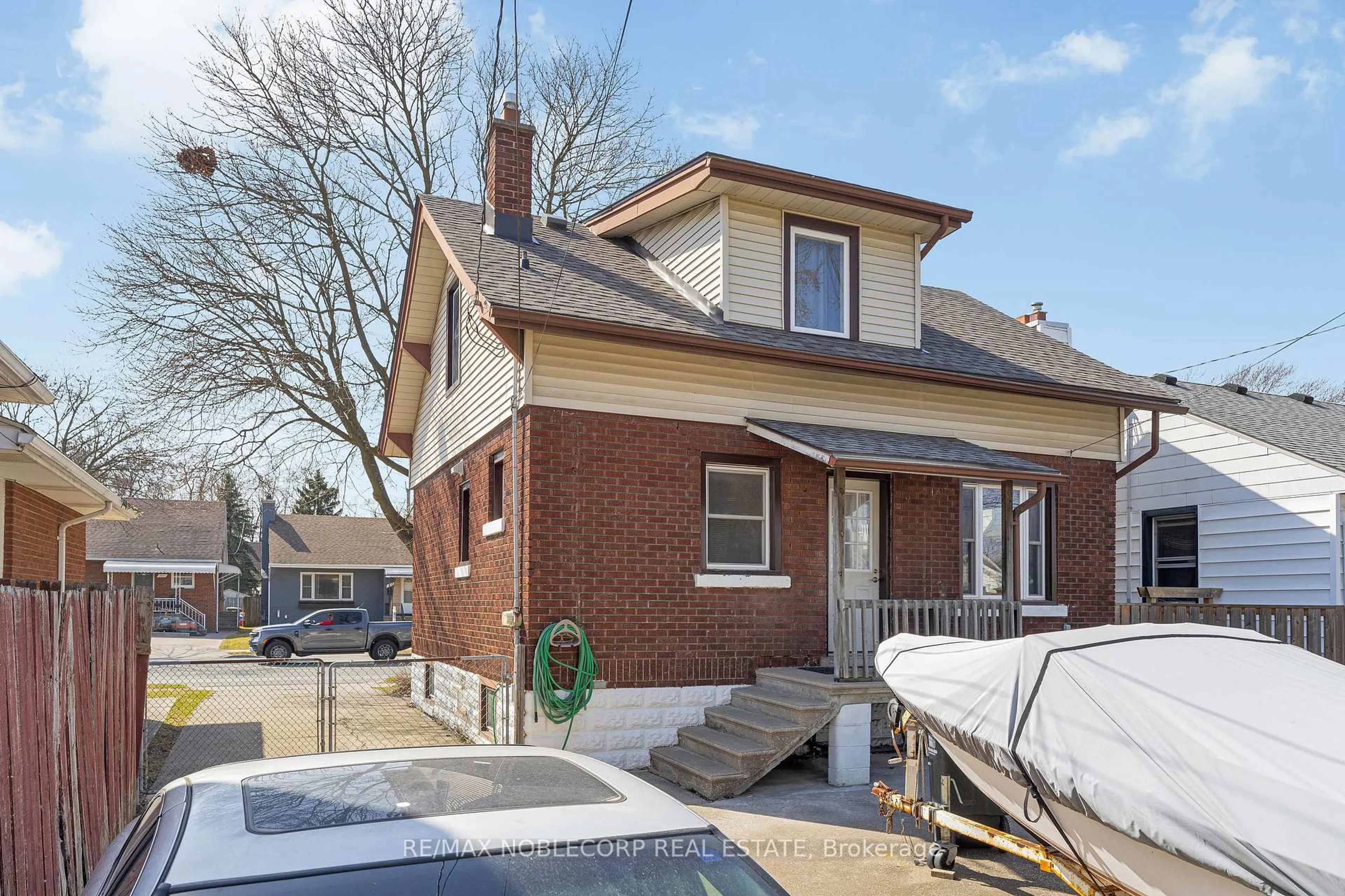 Home with brick exterior material, street for 1640 Pillette Rd, Windsor Ontario N8Y 3C5