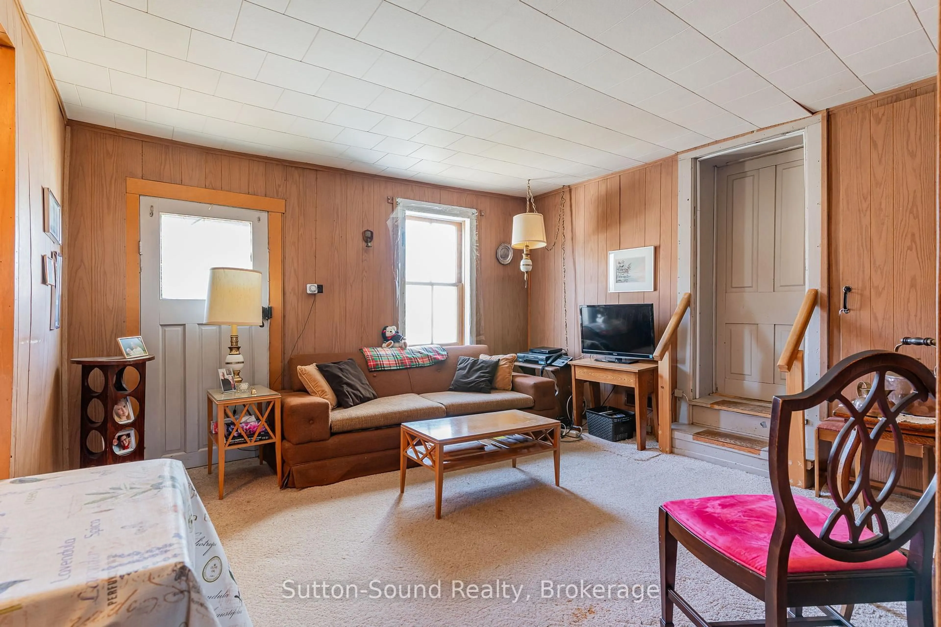 Living room with furniture, wood/laminate floor for 443 and 445 Taylor St, South Bruce Peninsula Ontario N0H 2T0