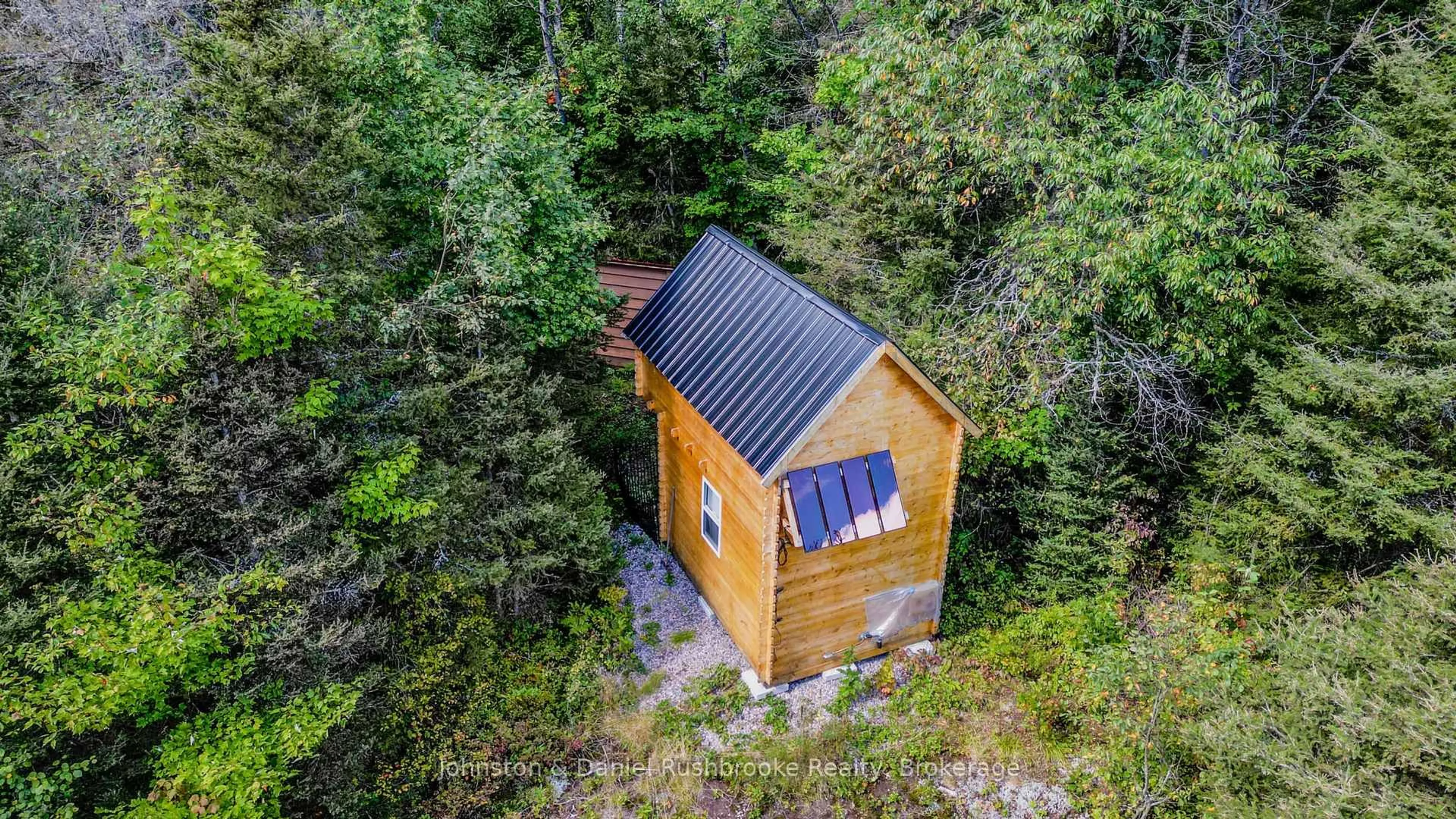 A pic from outside/outdoor area/front of a property/back of a property/a pic from drone, unknown for 77 GRINDSTONE Rd, Magnetawan Ontario P0A 1Z0