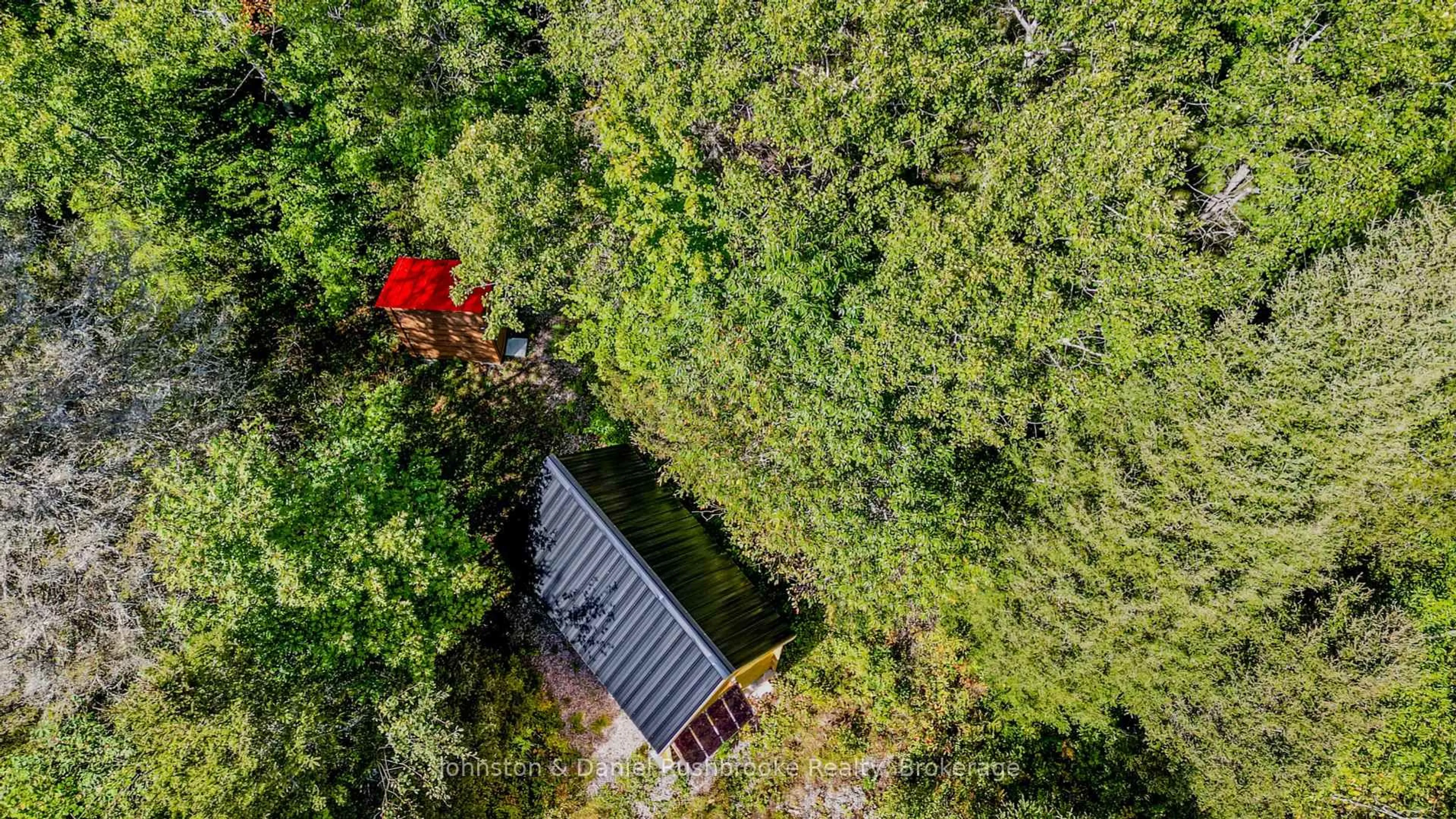 A pic from outside/outdoor area/front of a property/back of a property/a pic from drone, forest/trees view for 77 GRINDSTONE Rd, Magnetawan Ontario P0A 1Z0