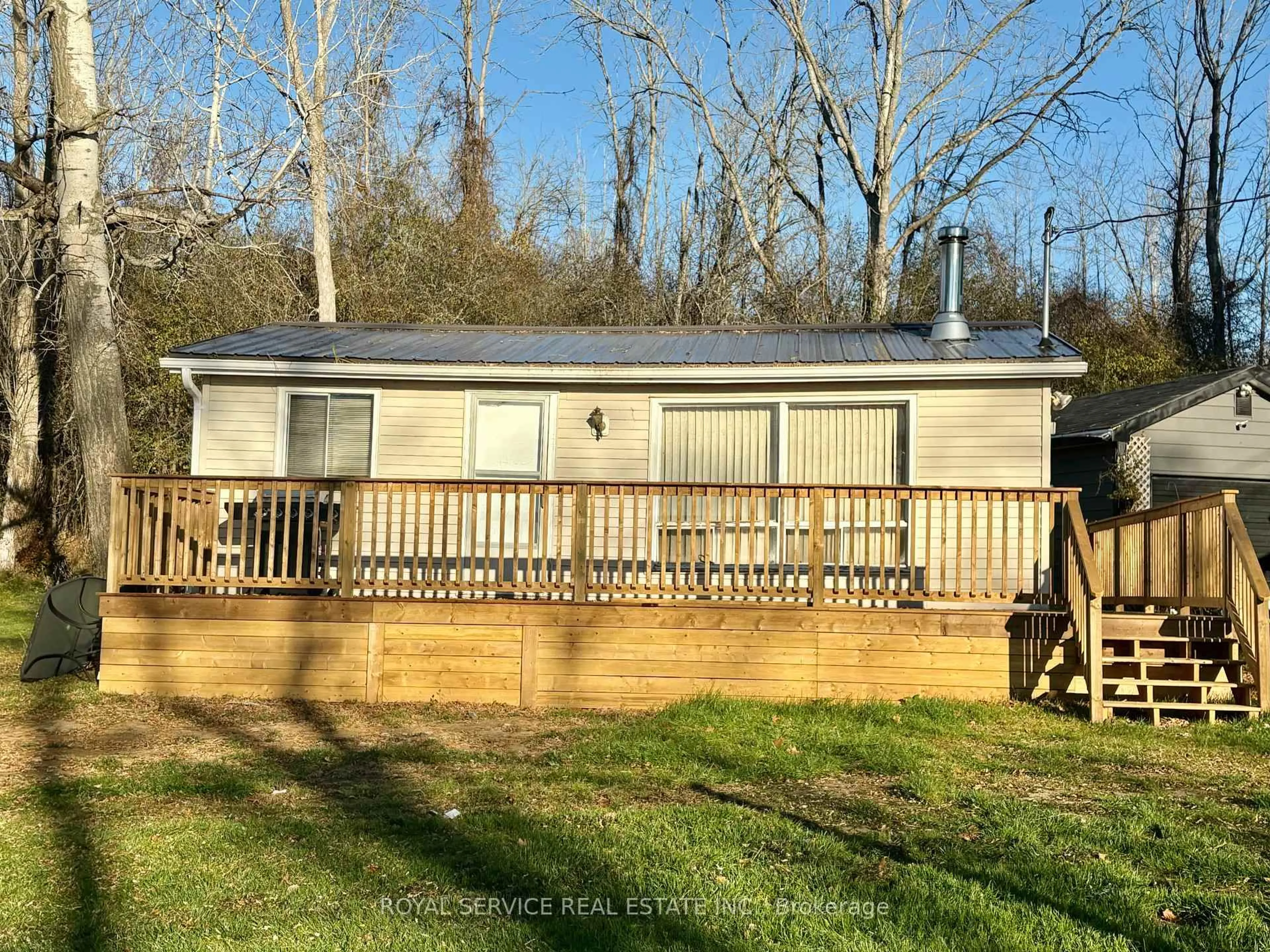 A pic from outside/outdoor area/front of a property/back of a property/a pic from drone, water/lake/river/ocean view for 76 Paudash St, Hiawatha First Nation Ontario K9J 0E6