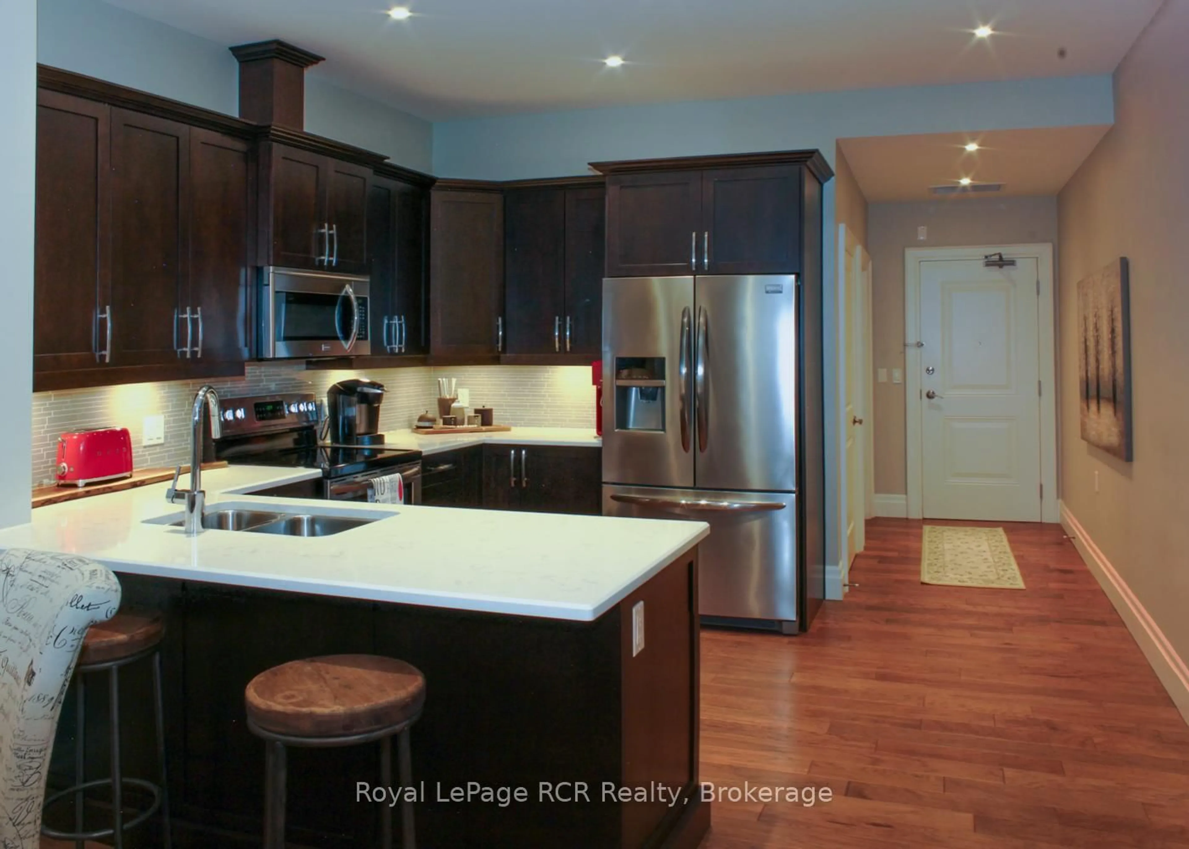 Open concept kitchen, wood/laminate floor for 945 3rd Ave #311, Owen Sound Ontario N4K 2K8