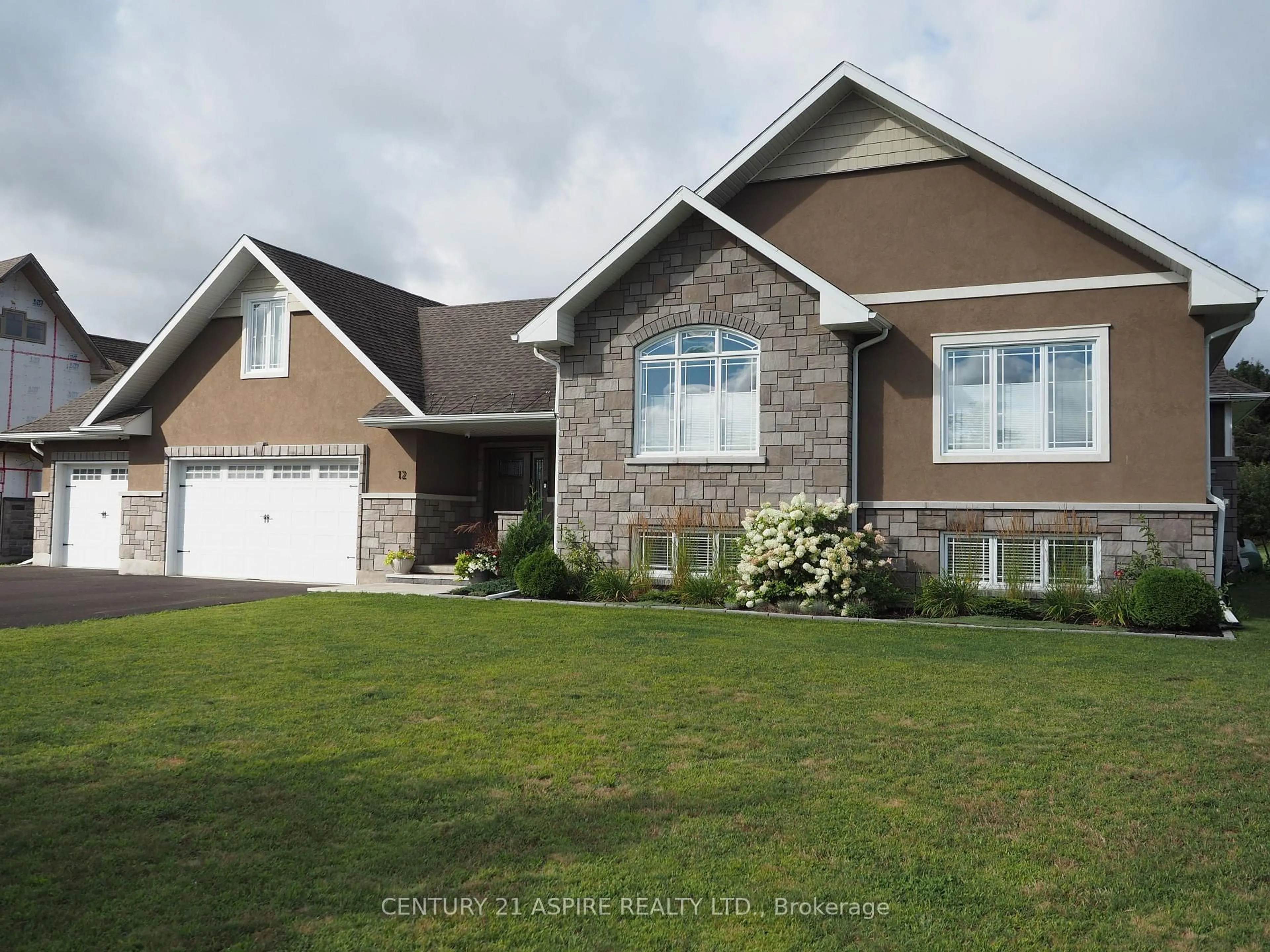 Home with vinyl exterior material, street for 12 Fairway Dr, Petawawa Ontario K8A 8N2