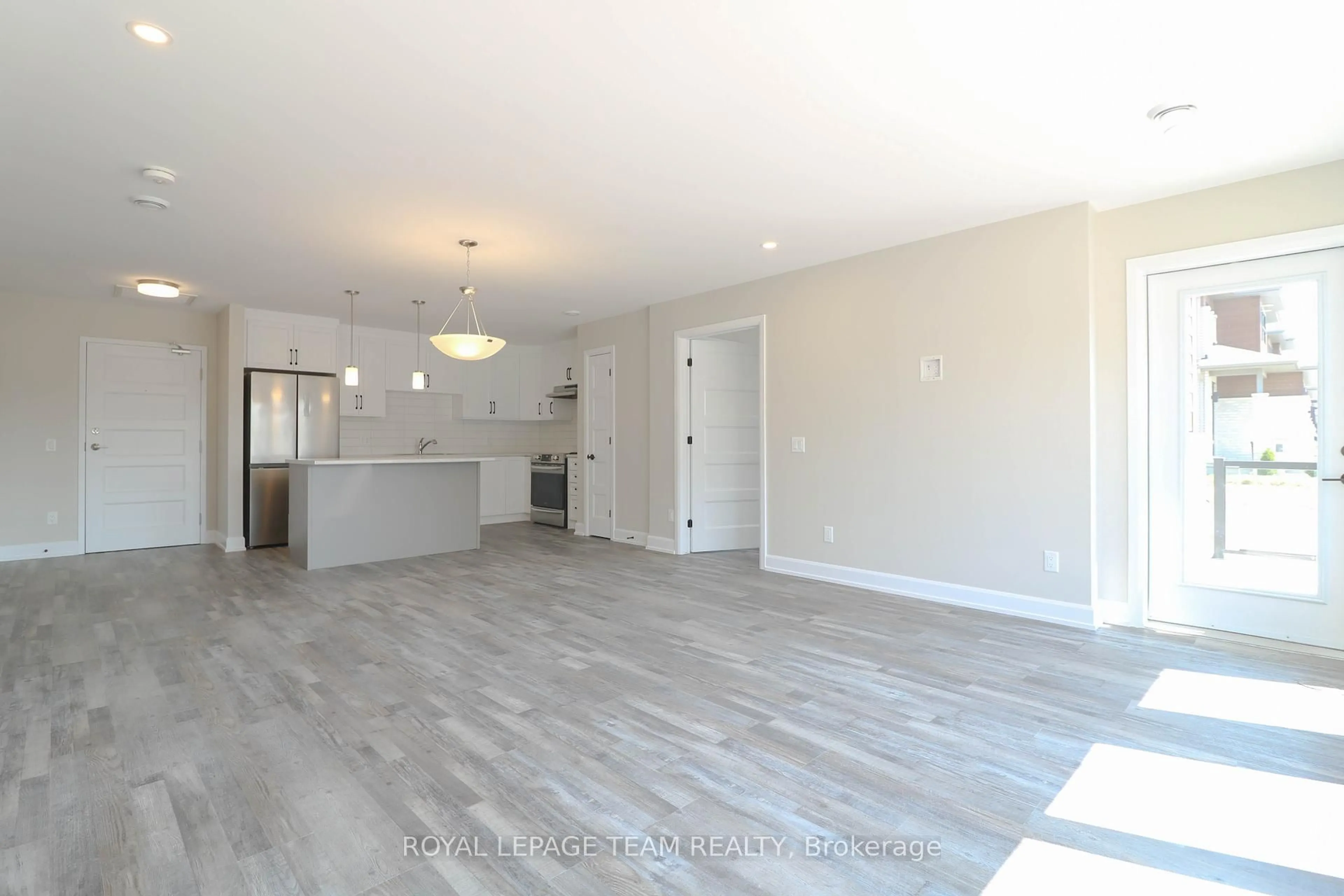 Open concept kitchen, wood/laminate floor for 271 Belfort St #101, Russell Ontario K0A 1W0