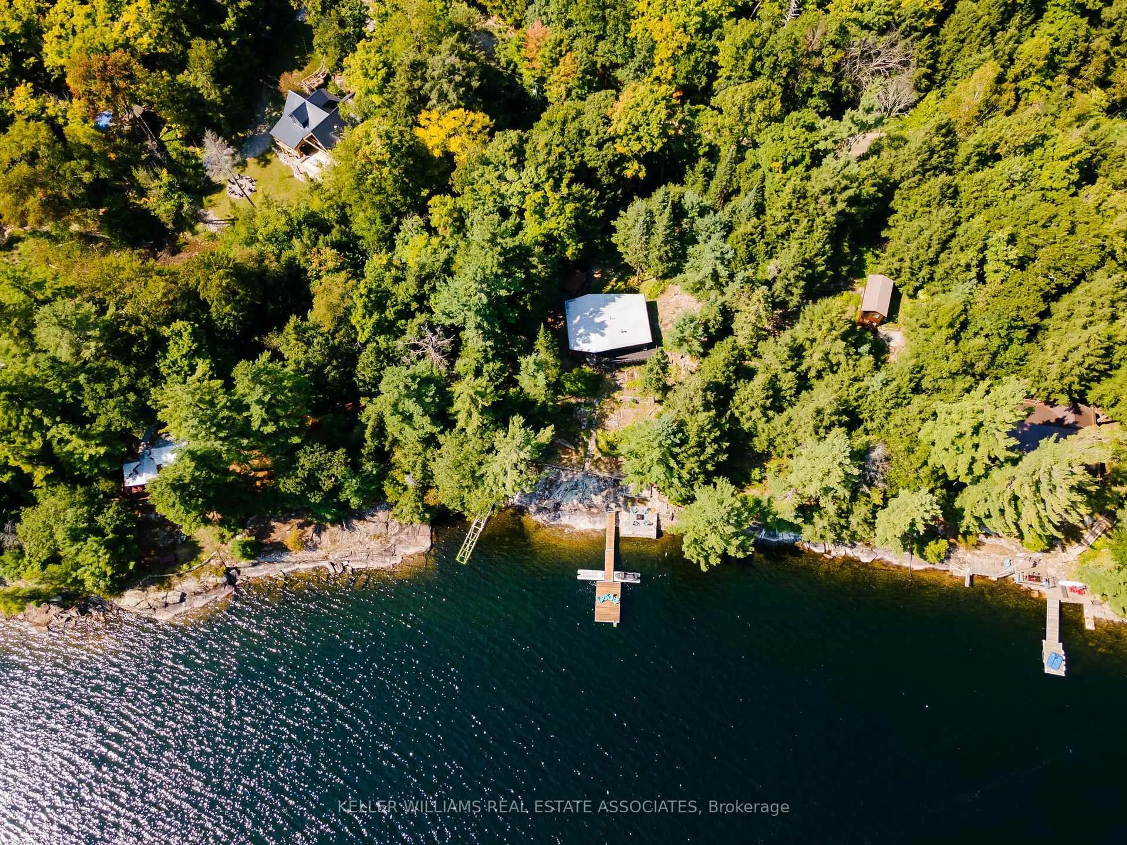 A pic from outside/outdoor area/front of a property/back of a property/a pic from drone, water/lake/river/ocean view for 6421 Kennisis Lake Rd, Dysart et al Ontario K0M 1S0