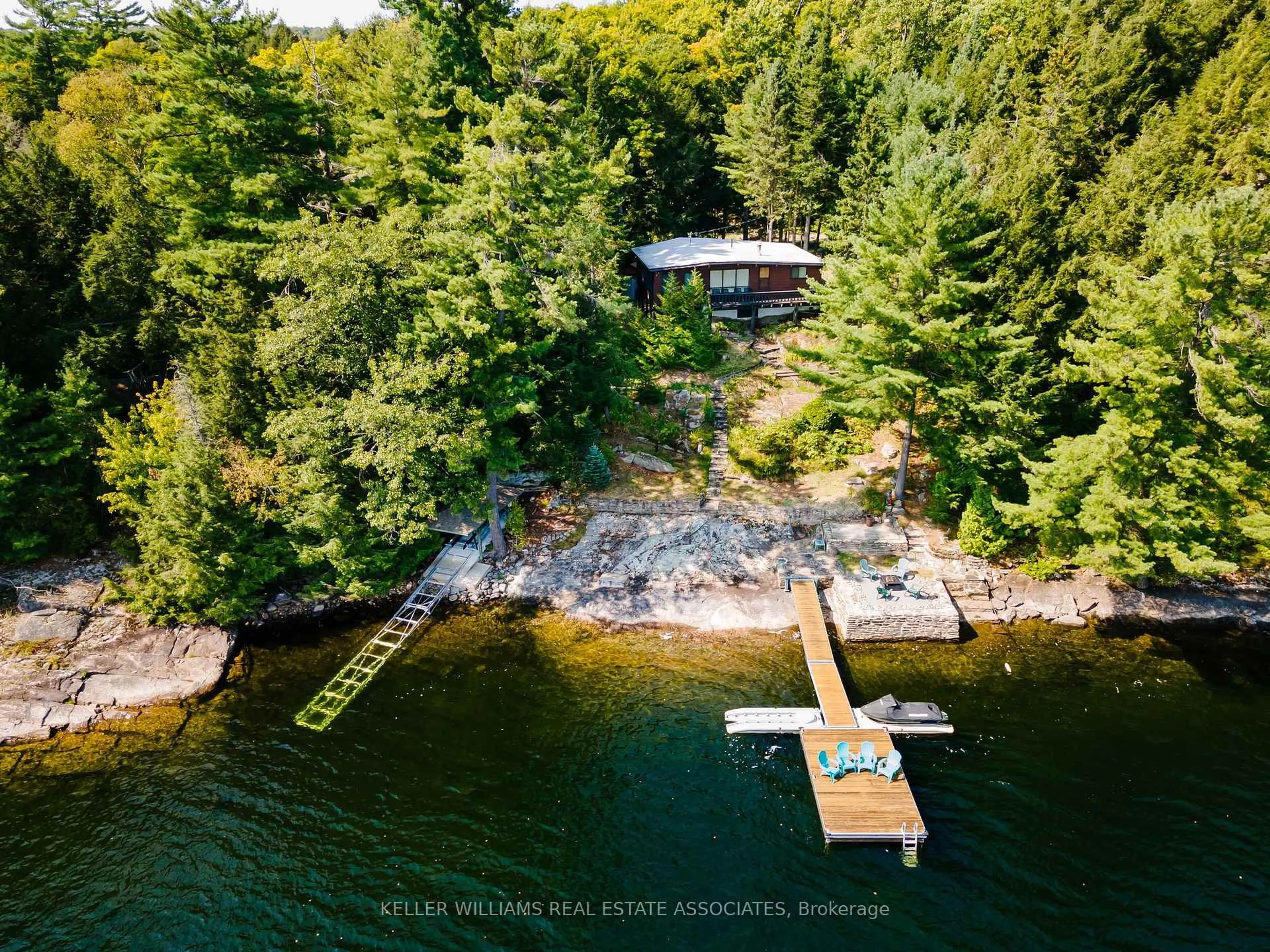 A pic from outside/outdoor area/front of a property/back of a property/a pic from drone, water/lake/river/ocean view for 6421 Kennisis Lake Rd, Dysart et al Ontario K0M 1S0