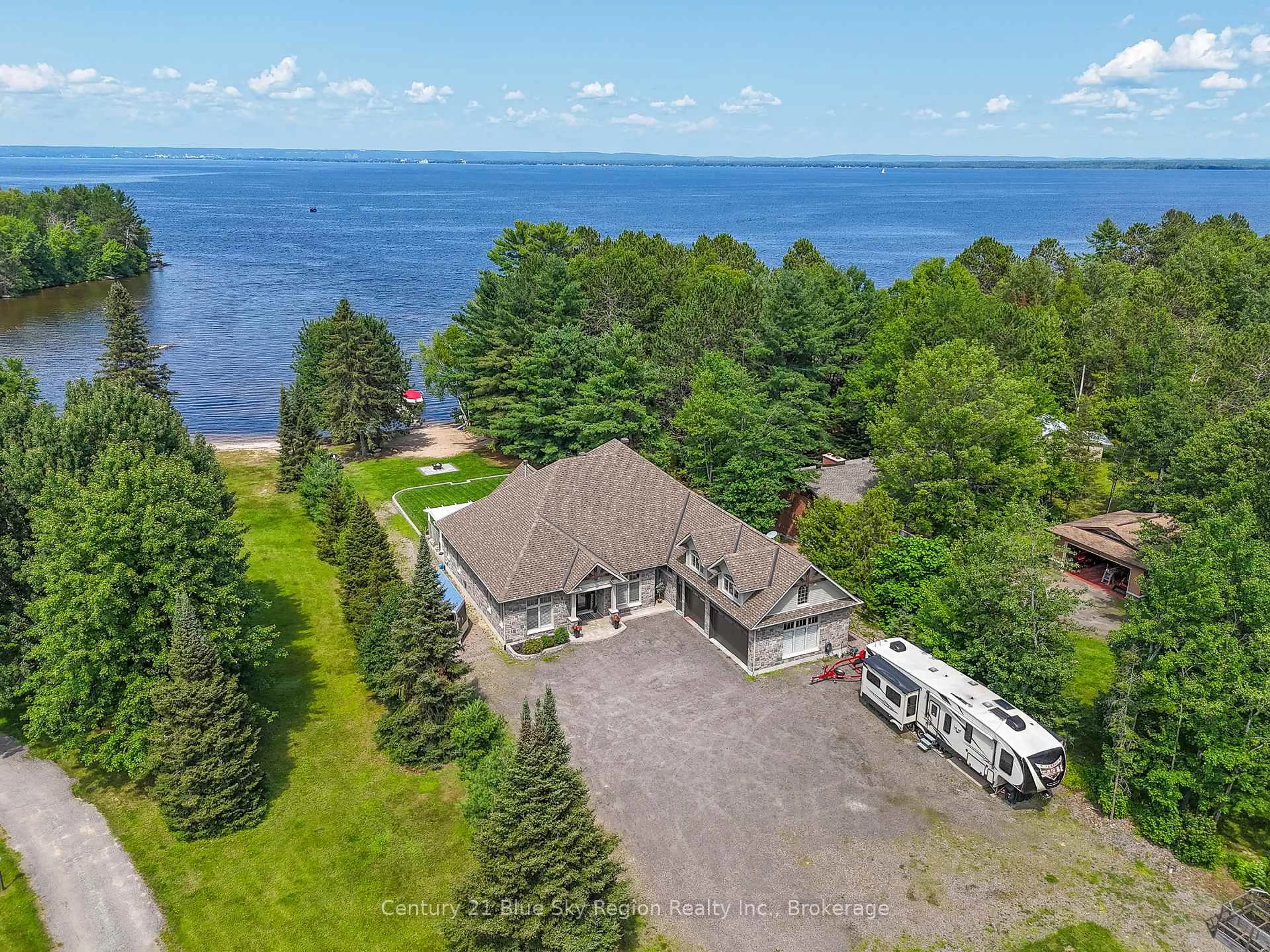 A pic from outside/outdoor area/front of a property/back of a property/a pic from drone, water/lake/river/ocean view for 34 Sunrise Bay Dr, Callander Ontario P0H 1H0