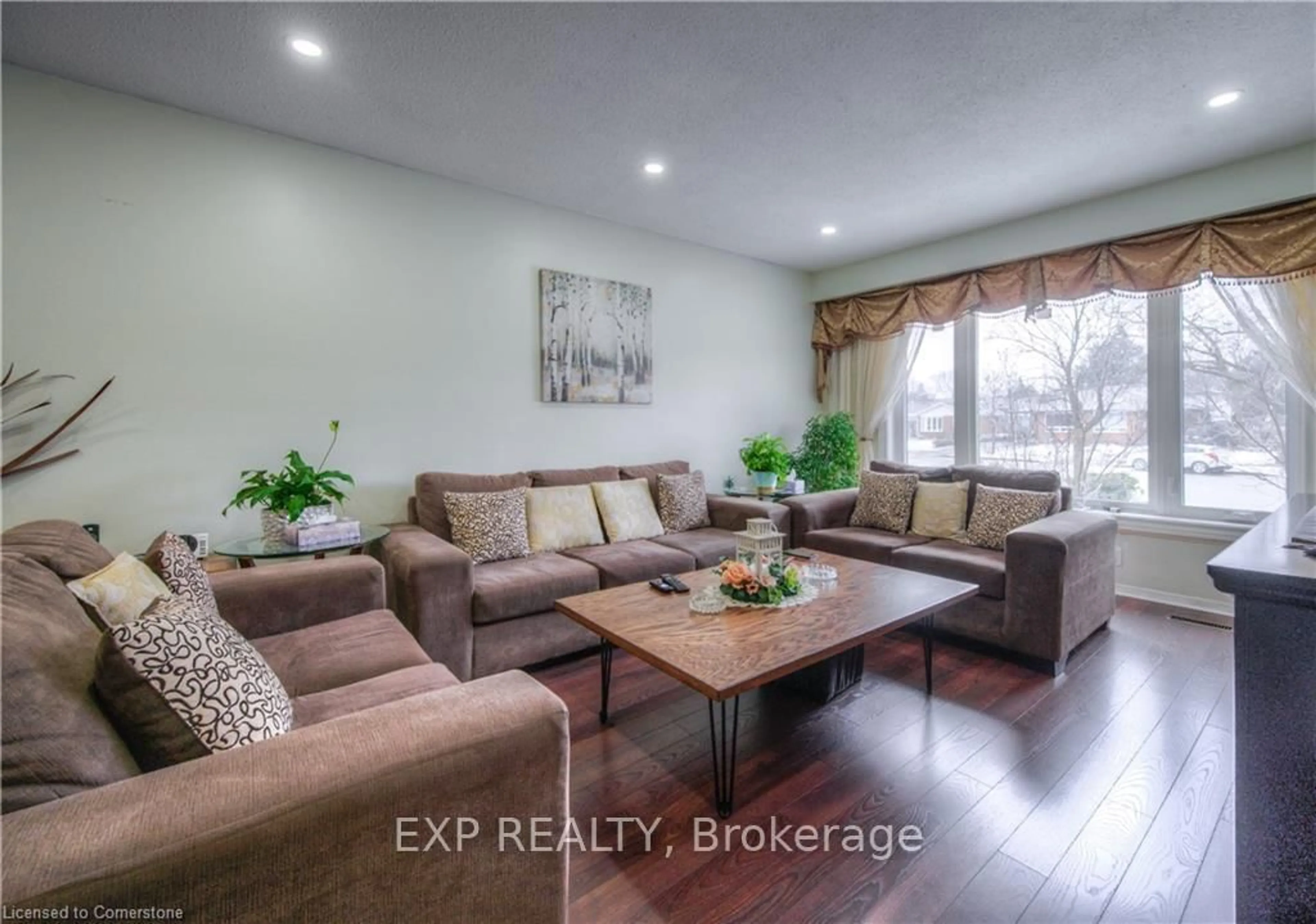 Living room with furniture, wood/laminate floor for 74 Markwood Dr, Kitchener Ontario N2M 2H6