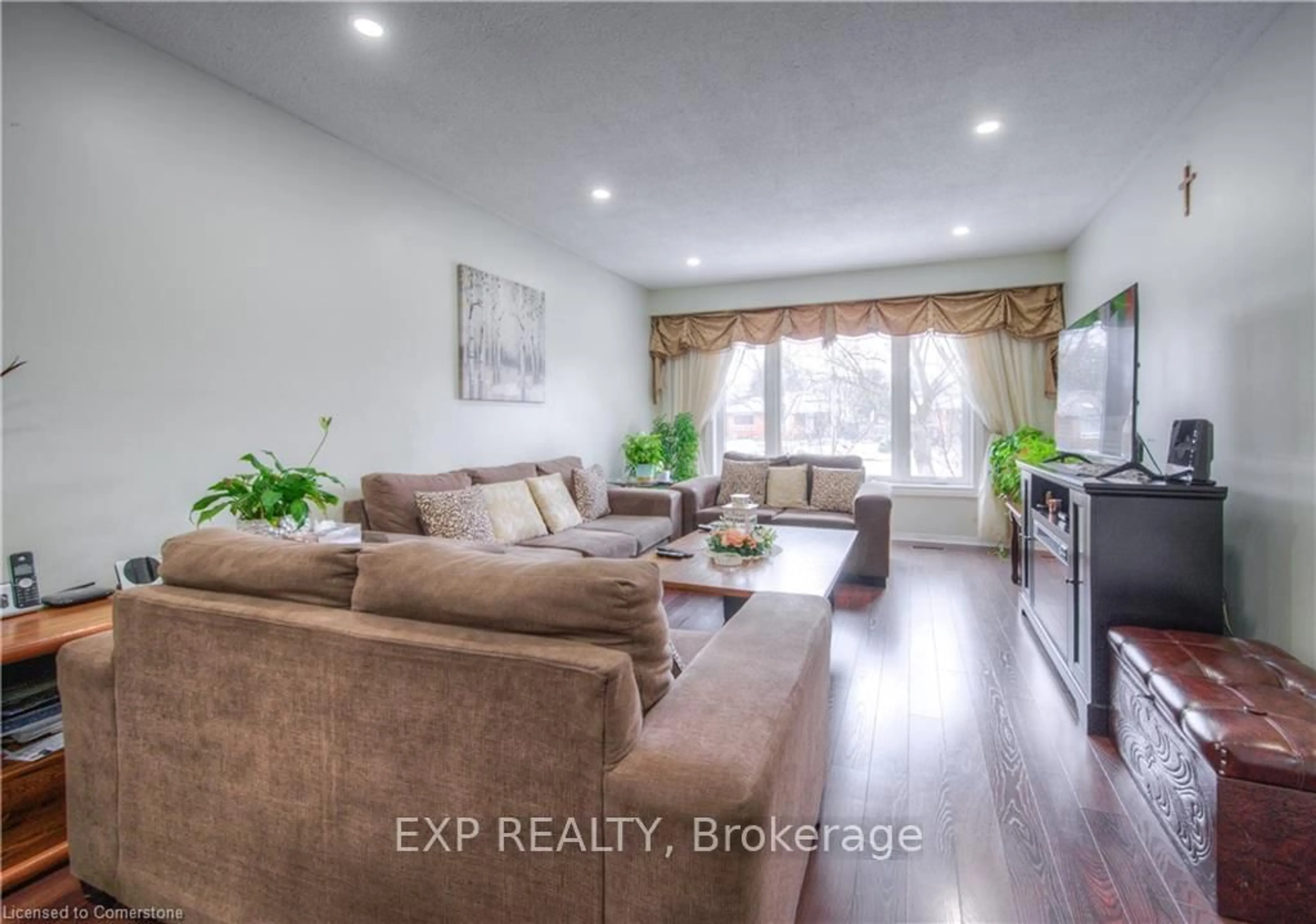 Living room with furniture, wood/laminate floor for 74 Markwood Dr, Kitchener Ontario N2M 2H6