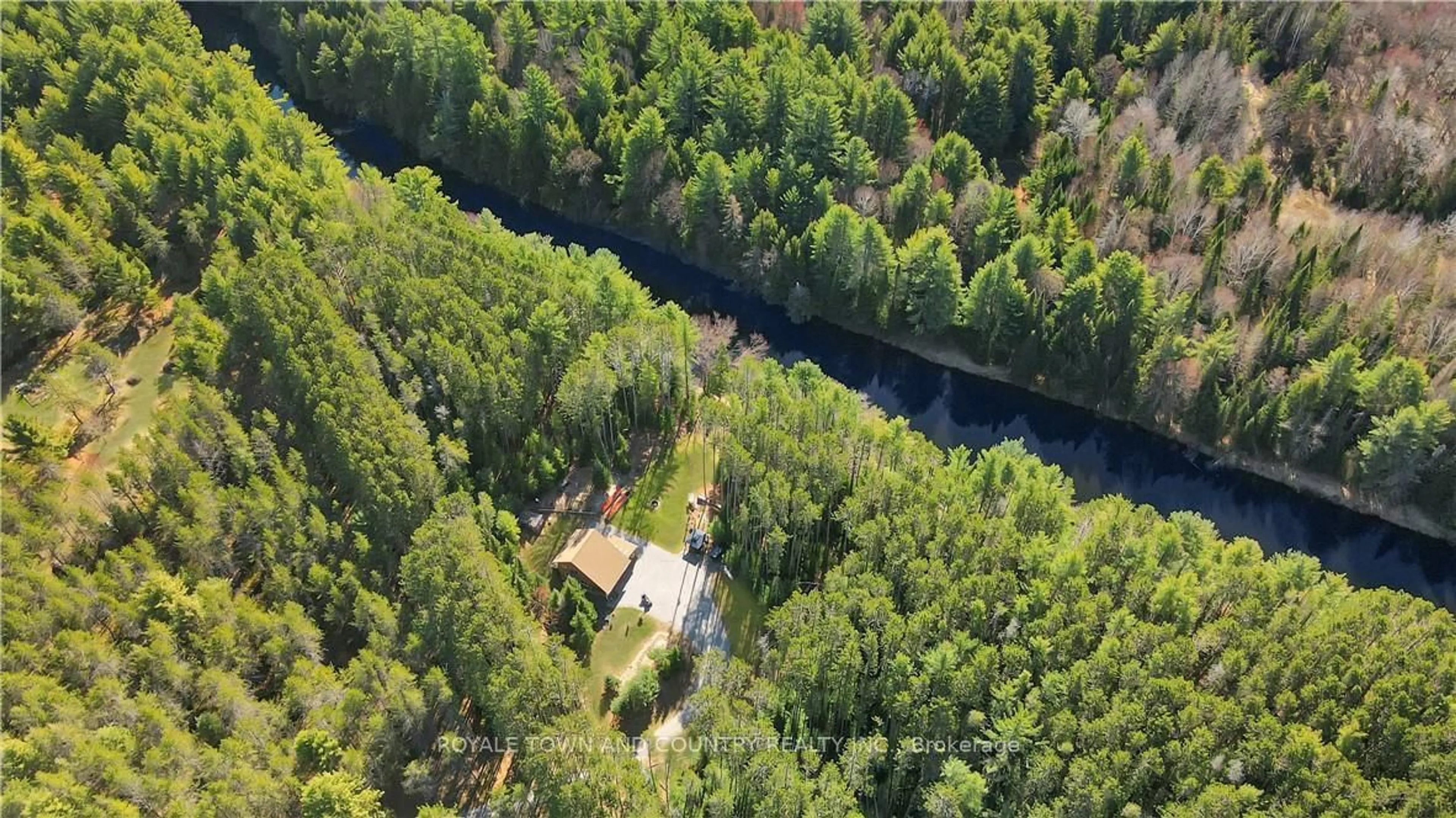 A pic from outside/outdoor area/front of a property/back of a property/a pic from drone, forest/trees view for 22 Winchester Dr, Kawartha Lakes Ontario K0M 1C0