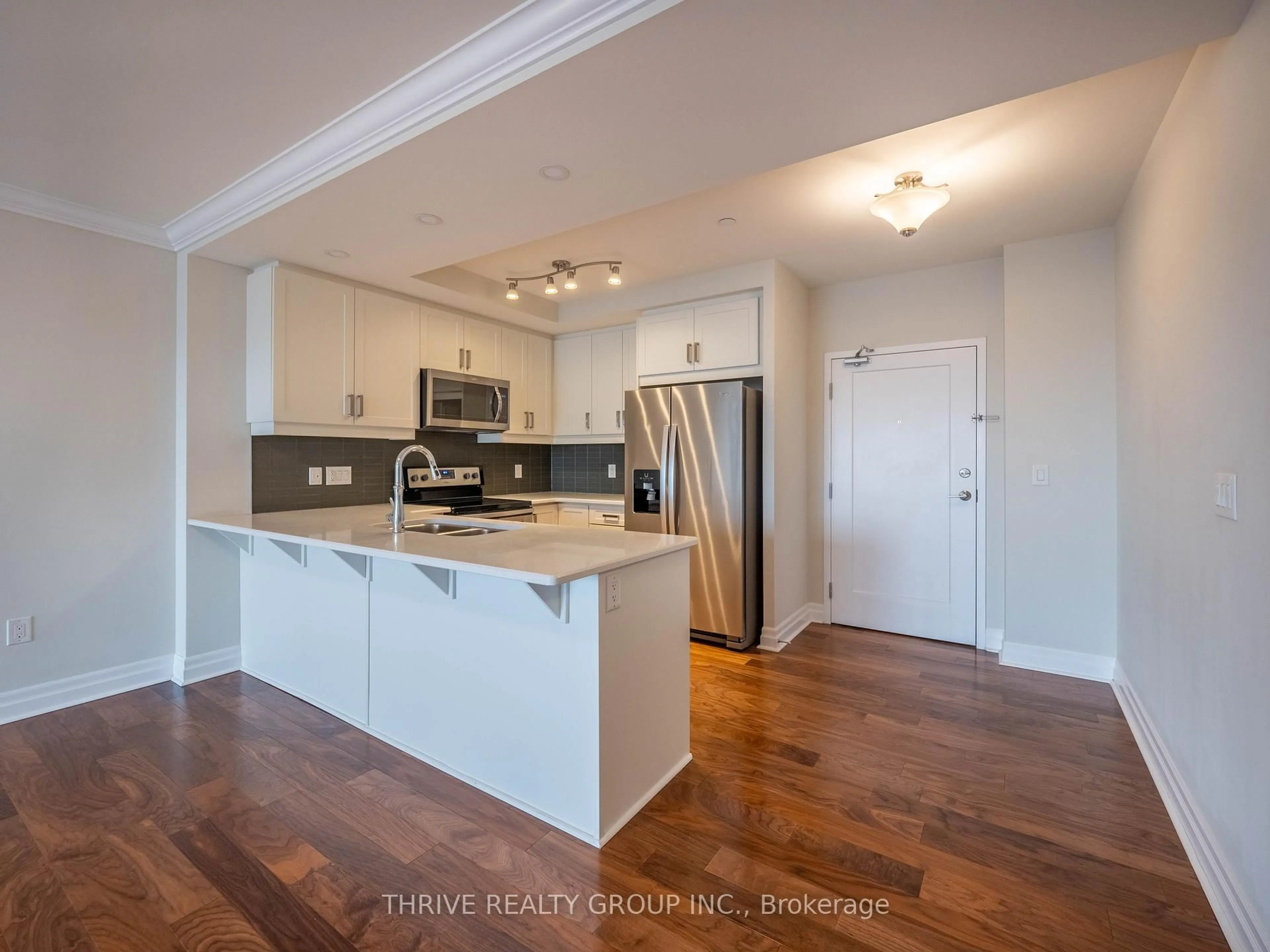 Open concept kitchen, wood/laminate floor for 505 Talbot St #1705, London East Ontario N6A 2S6