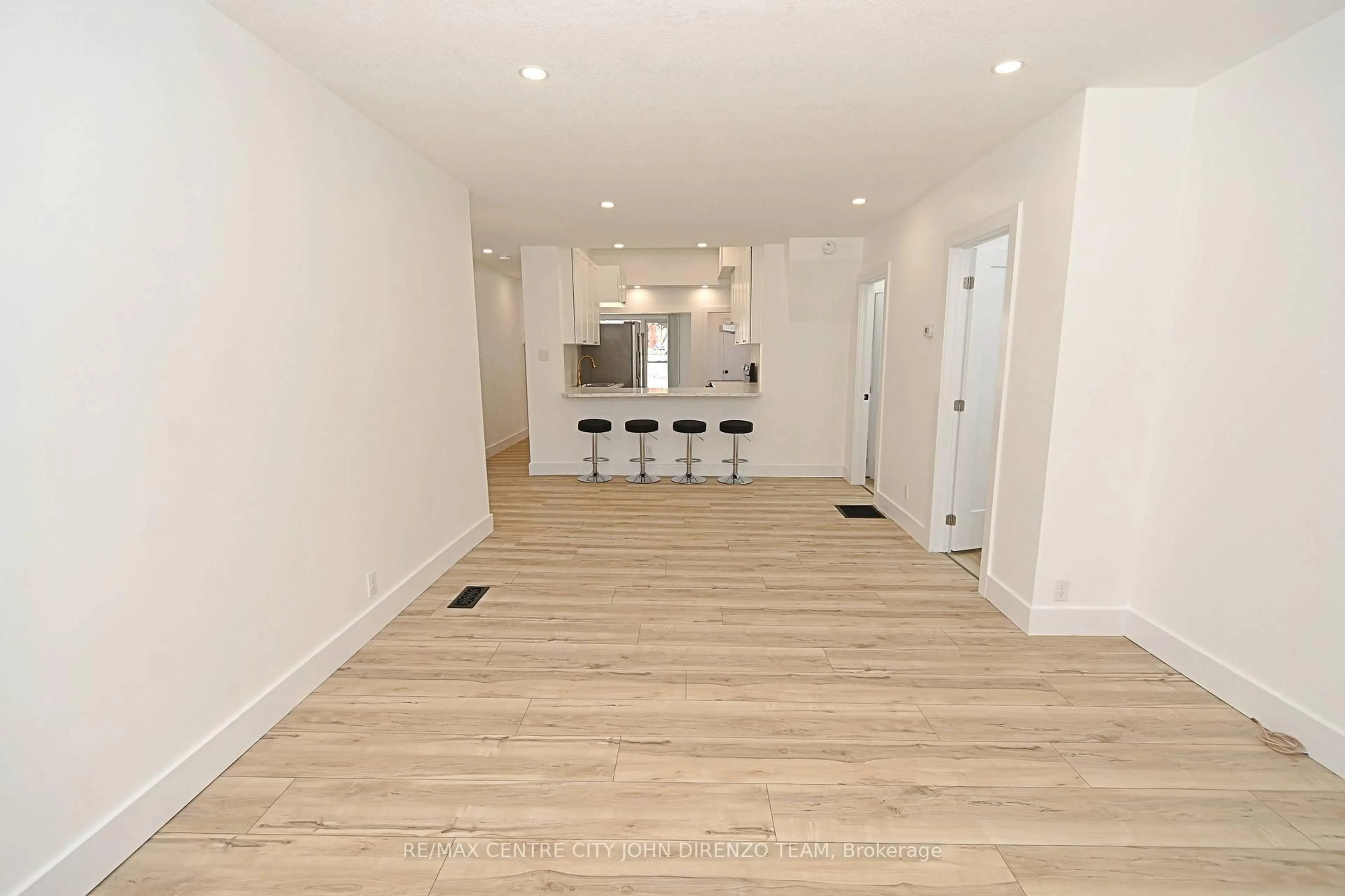 Open concept kitchen, wood/laminate floor for 87 Gladstone Ave, St. Thomas Ontario N5R 2L9