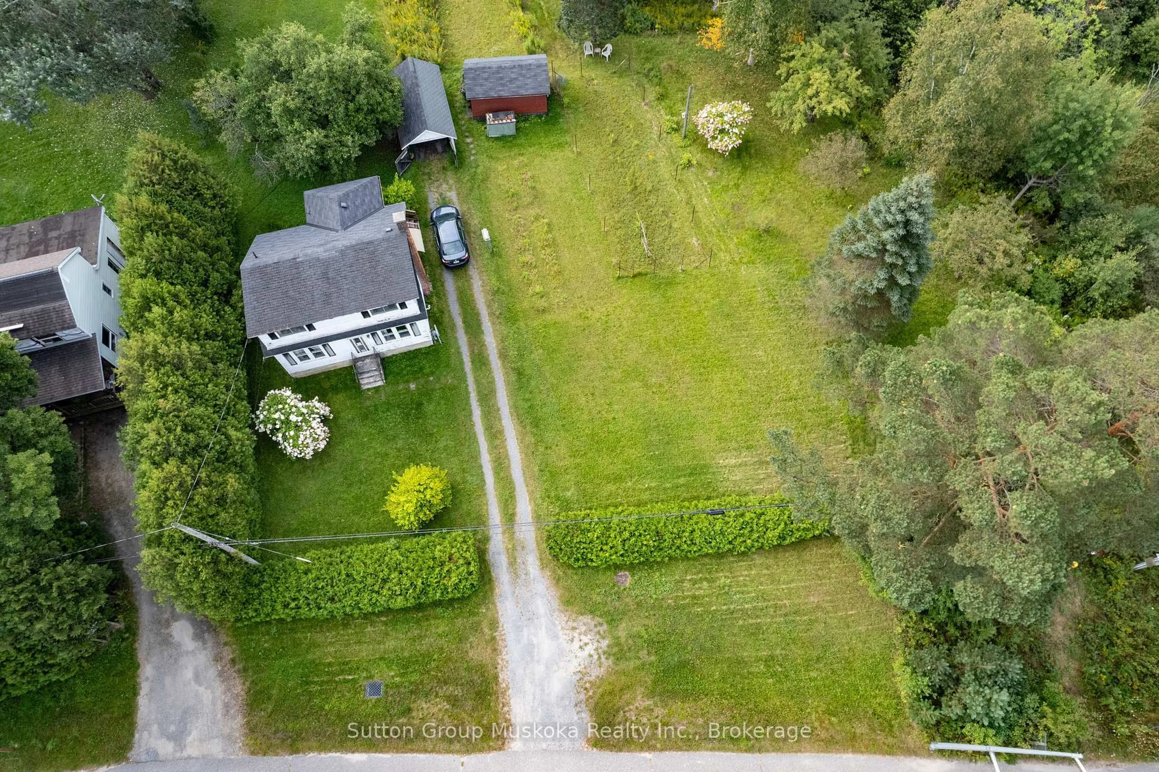 A pic from outside/outdoor area/front of a property/back of a property/a pic from drone, street for 183 West Rd, Huntsville Ontario P1H 1M7