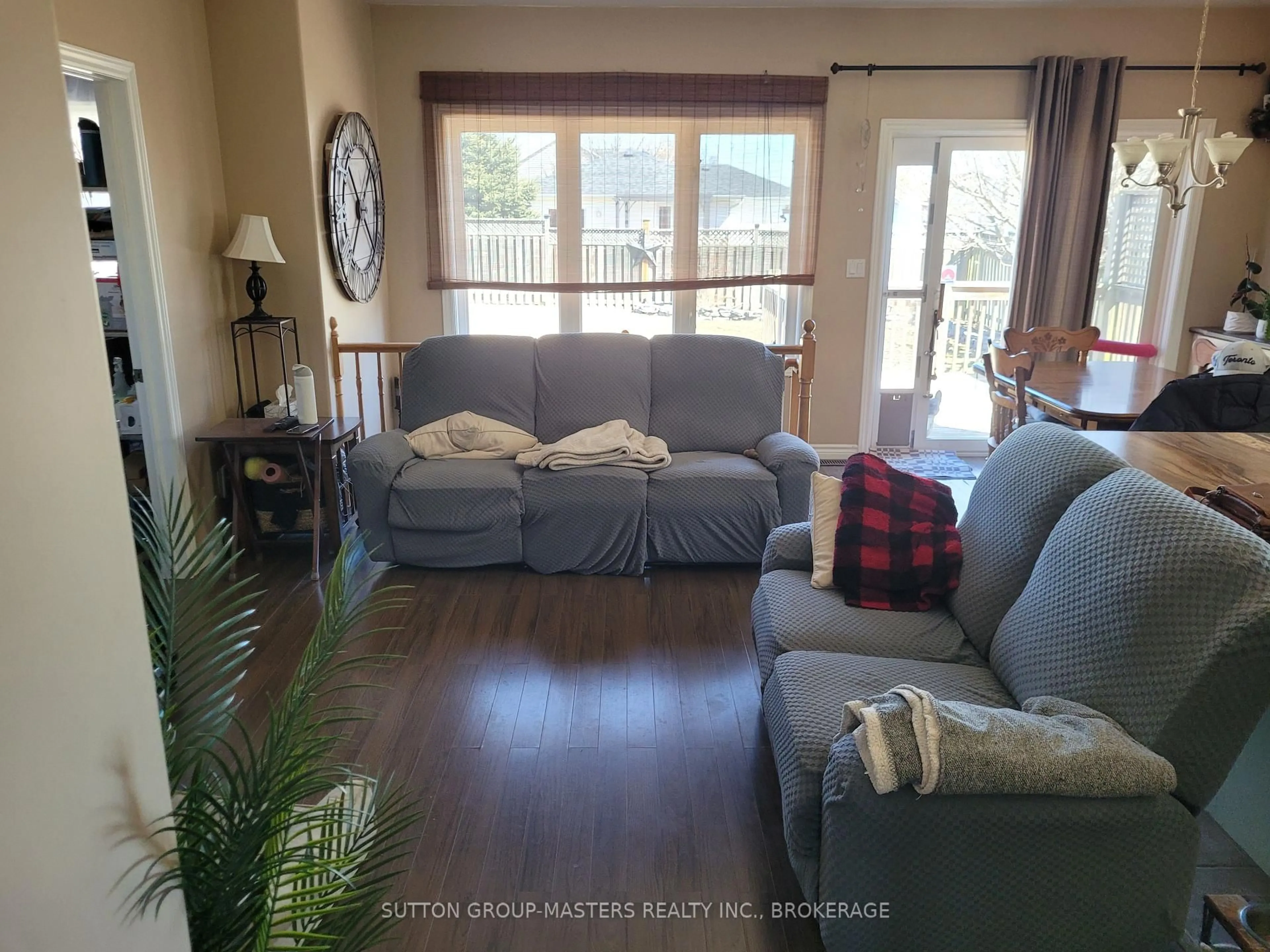 Living room with furniture, wood/laminate floor for 129 Macdougall Dr, Loyalist Ontario K7N 0A2