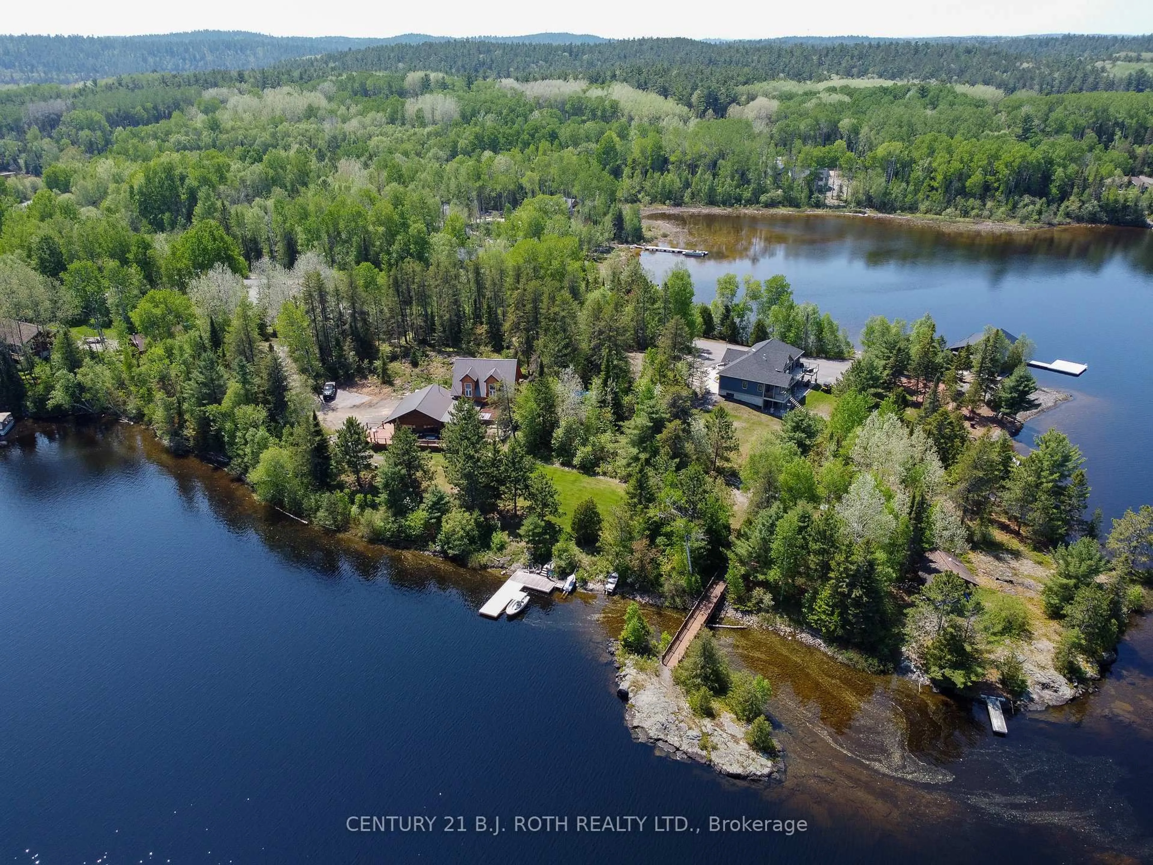 A pic from outside/outdoor area/front of a property/back of a property/a pic from drone, water/lake/river/ocean view for 59 White Bear Crt, Temagami Ontario P0H 2H0