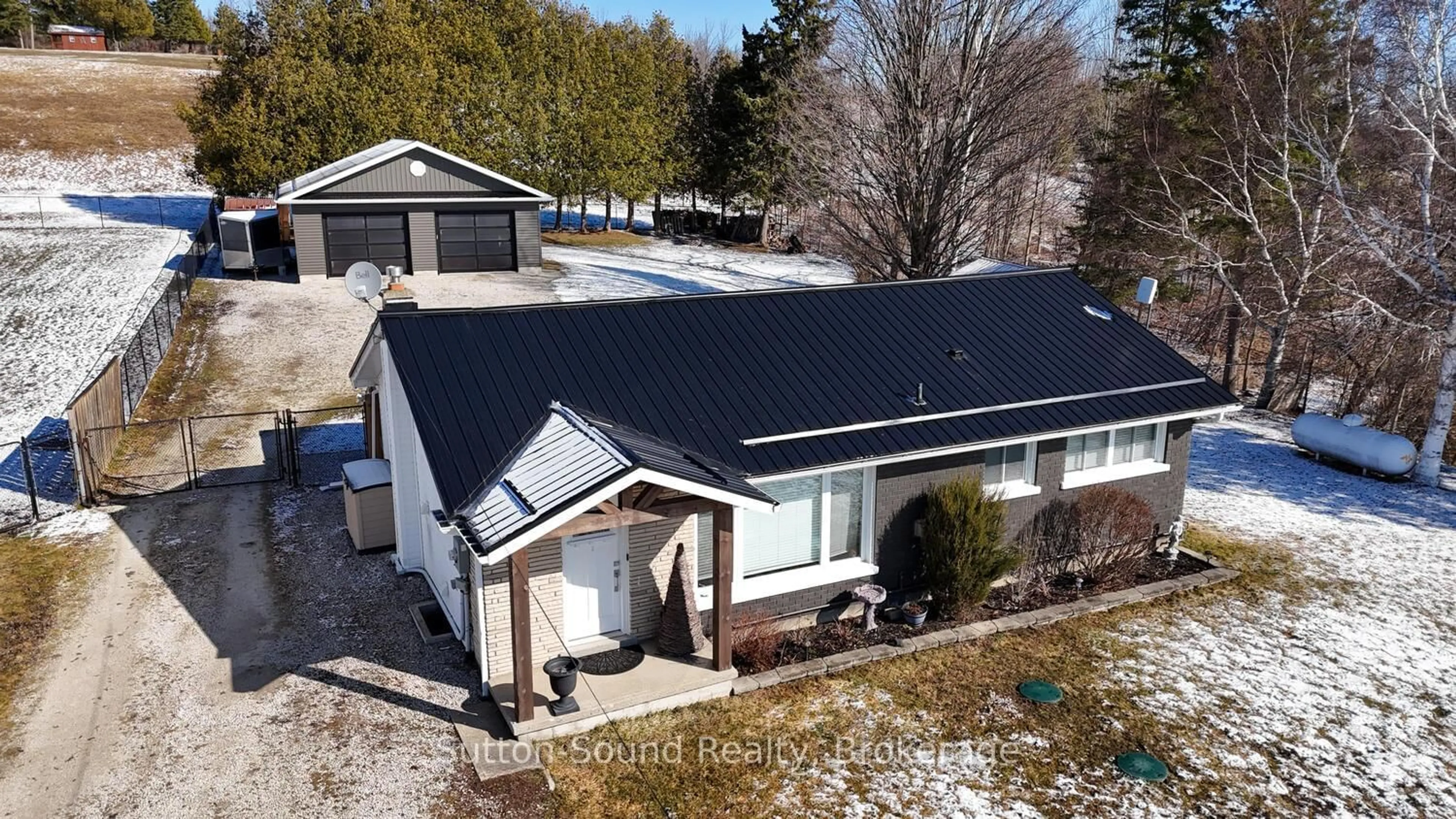 A pic from outside/outdoor area/front of a property/back of a property/a pic from drone, street for 202093 21 Highway, Georgian Bluffs Ontario N4K 5N7