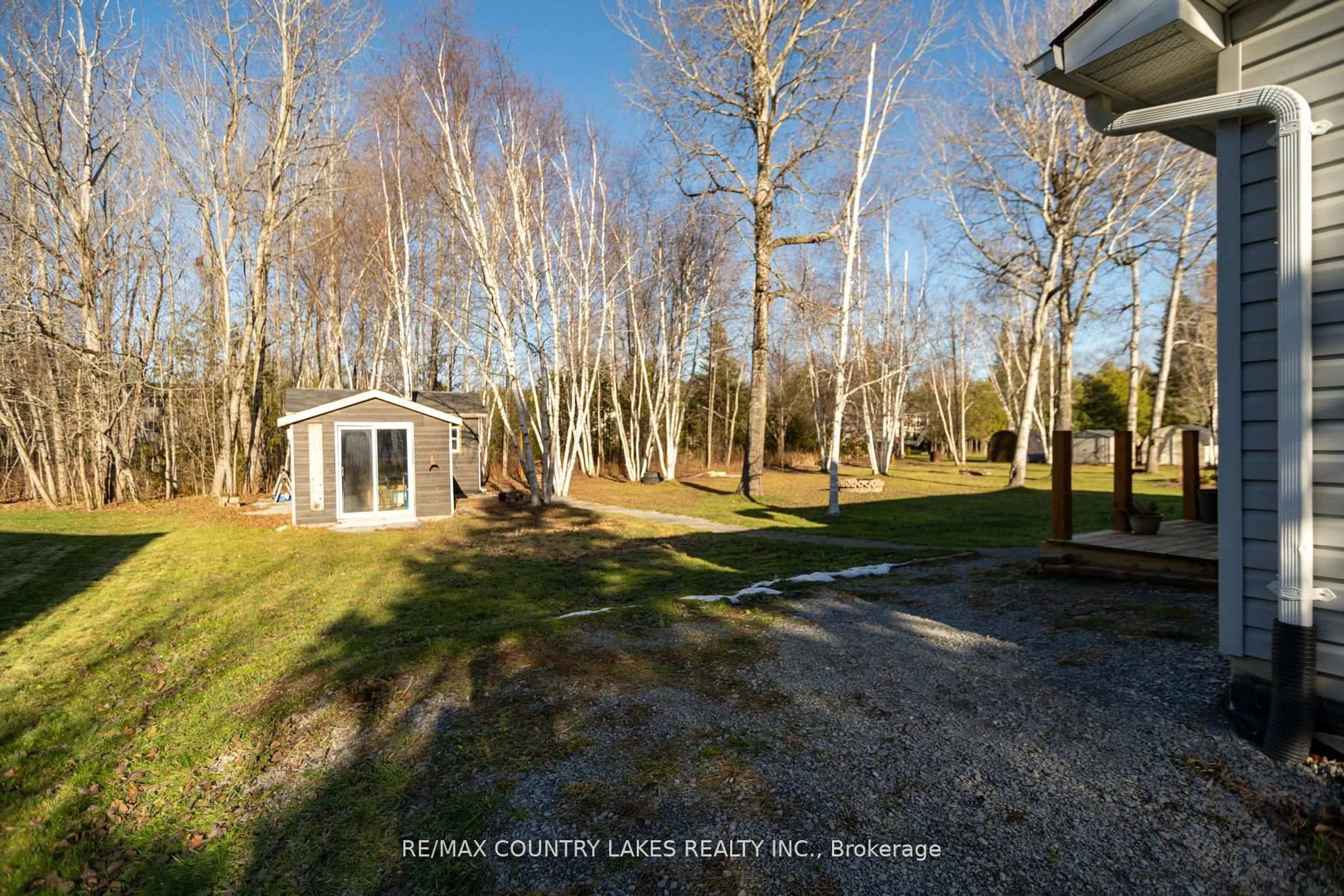 A pic from outside/outdoor area/front of a property/back of a property/a pic from drone, forest/trees view for 40 Greenwood Cres, Kawartha Lakes Ontario K0M 2T0