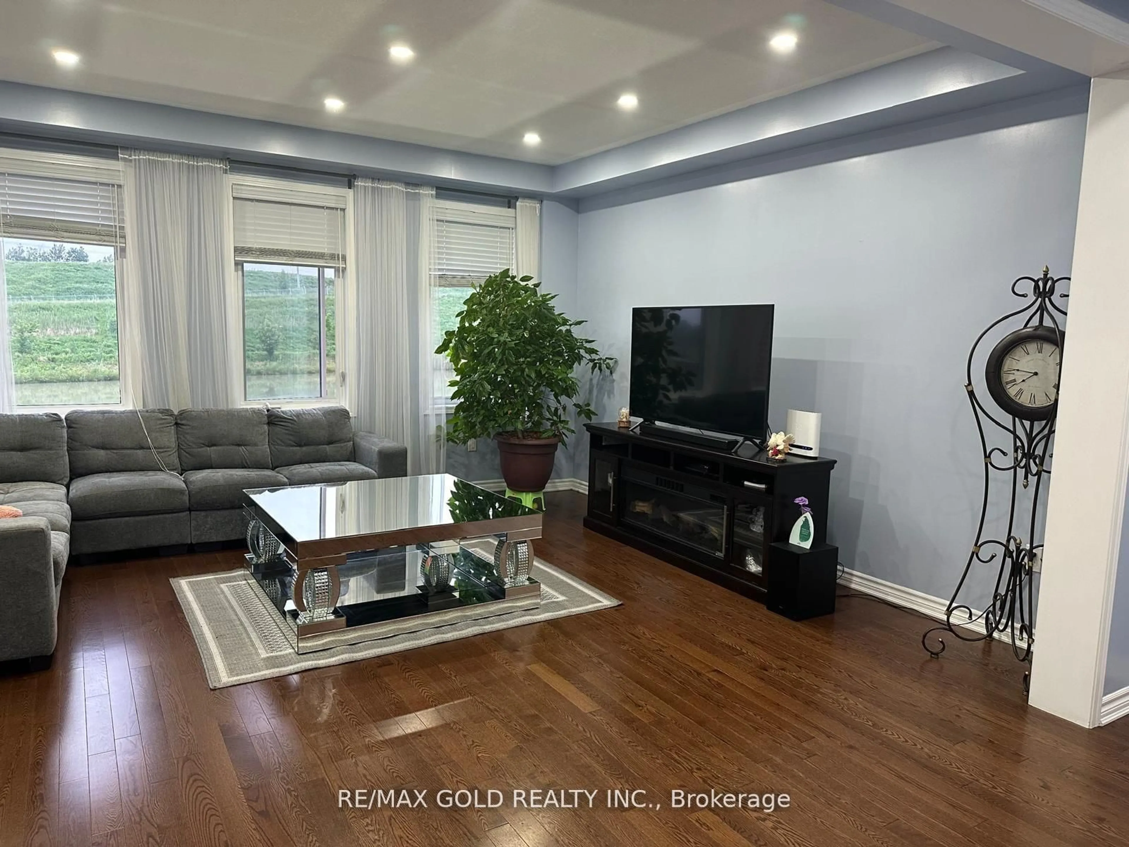 Living room with furniture, wood/laminate floor for 95 Wannamaker Cres, Cambridge Ontario N3E 0C5