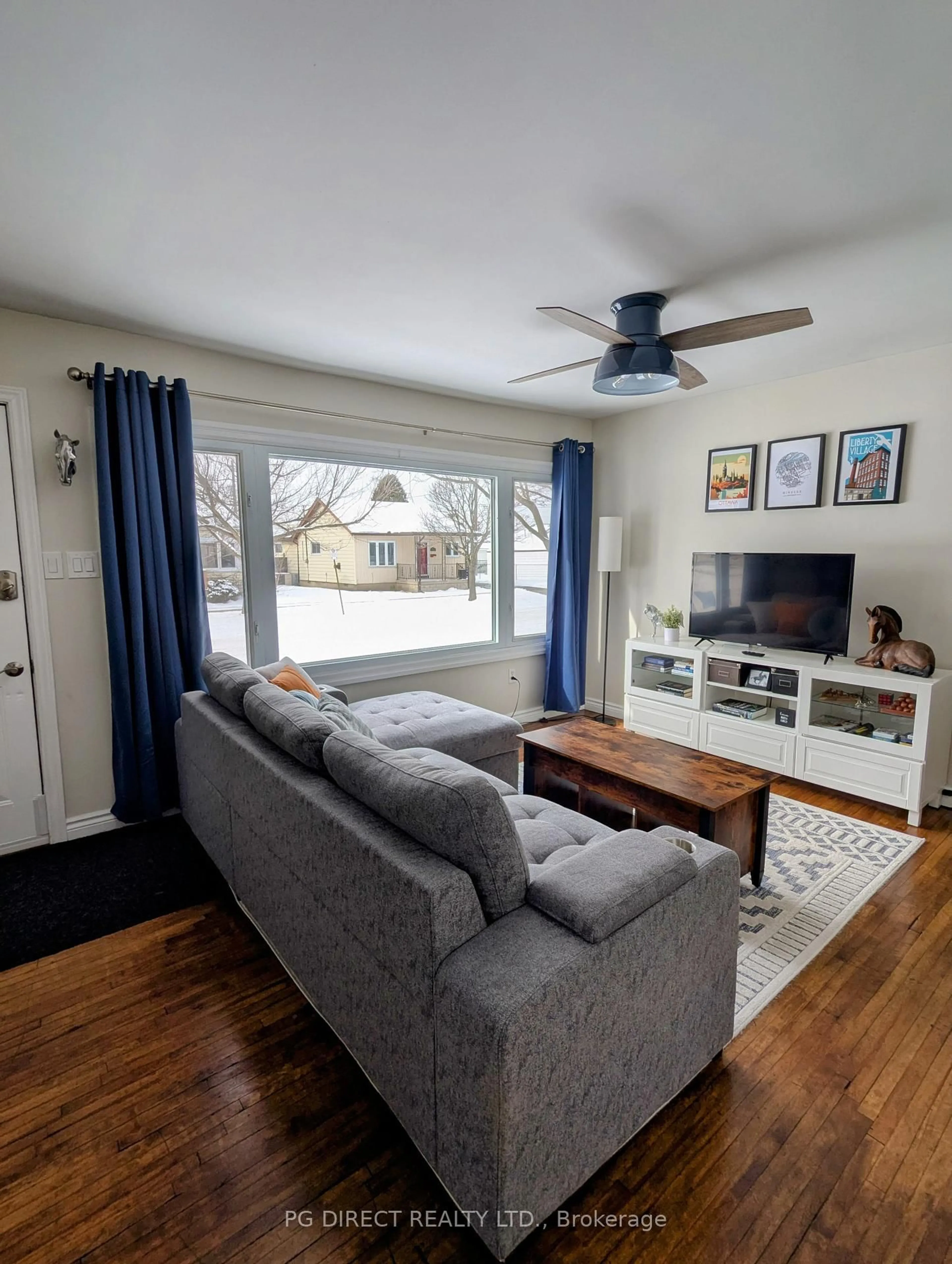 Living room with furniture, wood/laminate floor for 2394 Louis Ave, Windsor Ontario N8W 2B8