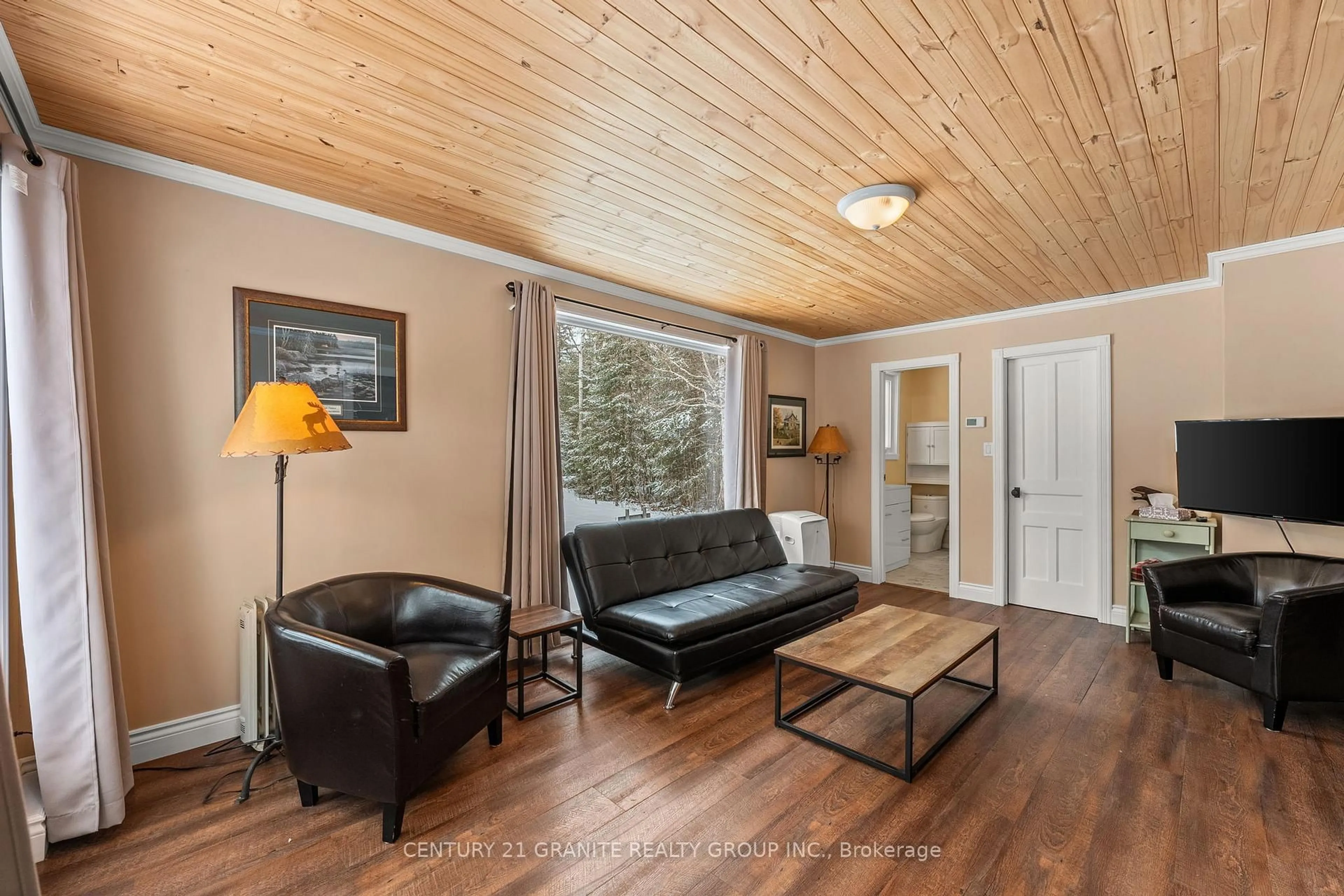 Living room with furniture, wood/laminate floor for 304 Centre Rd, Maynooth Ontario K0L 2K0