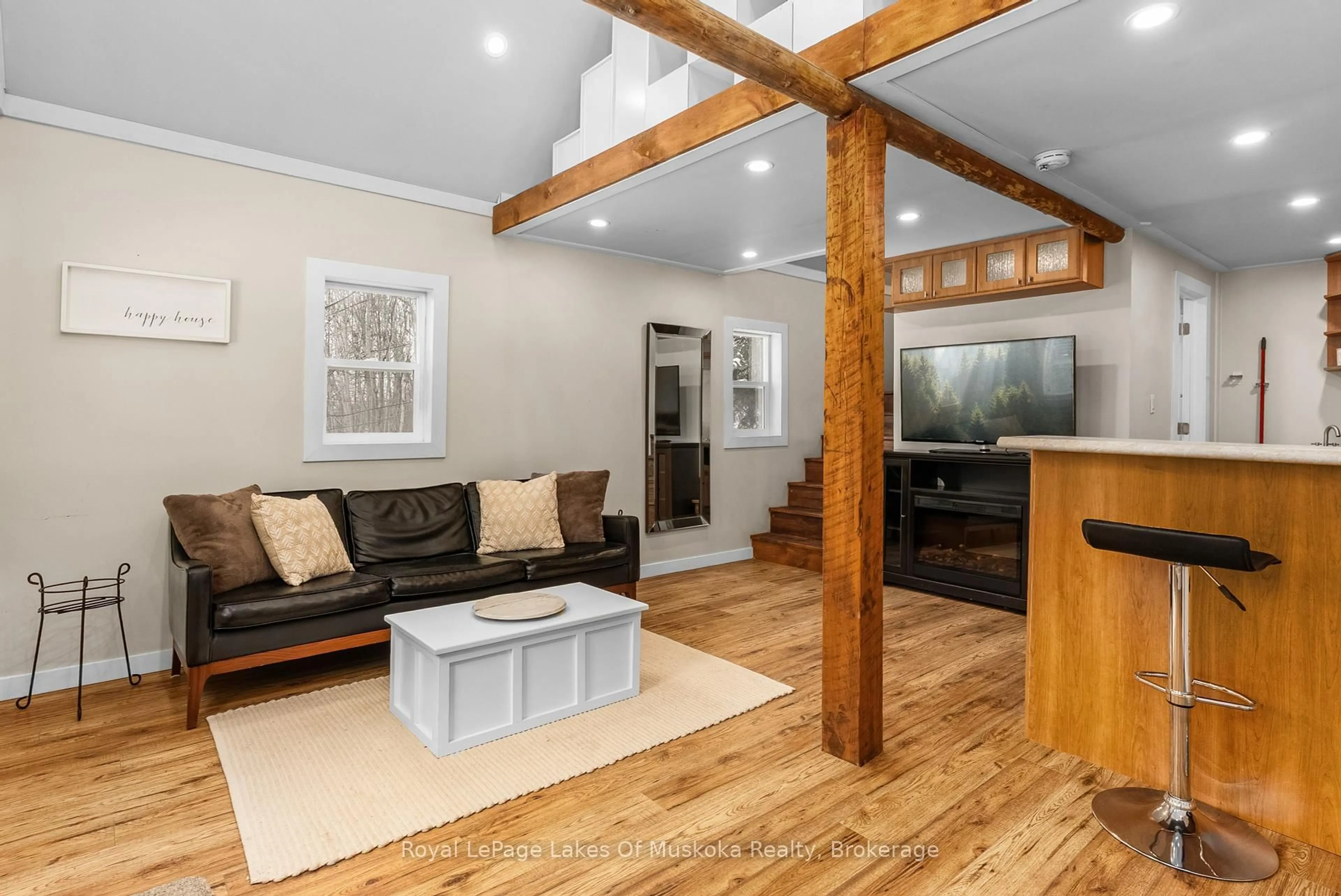 Living room with furniture, wood/laminate floor for 87 Ferguson Rd, Armour Ontario P0A 1C0