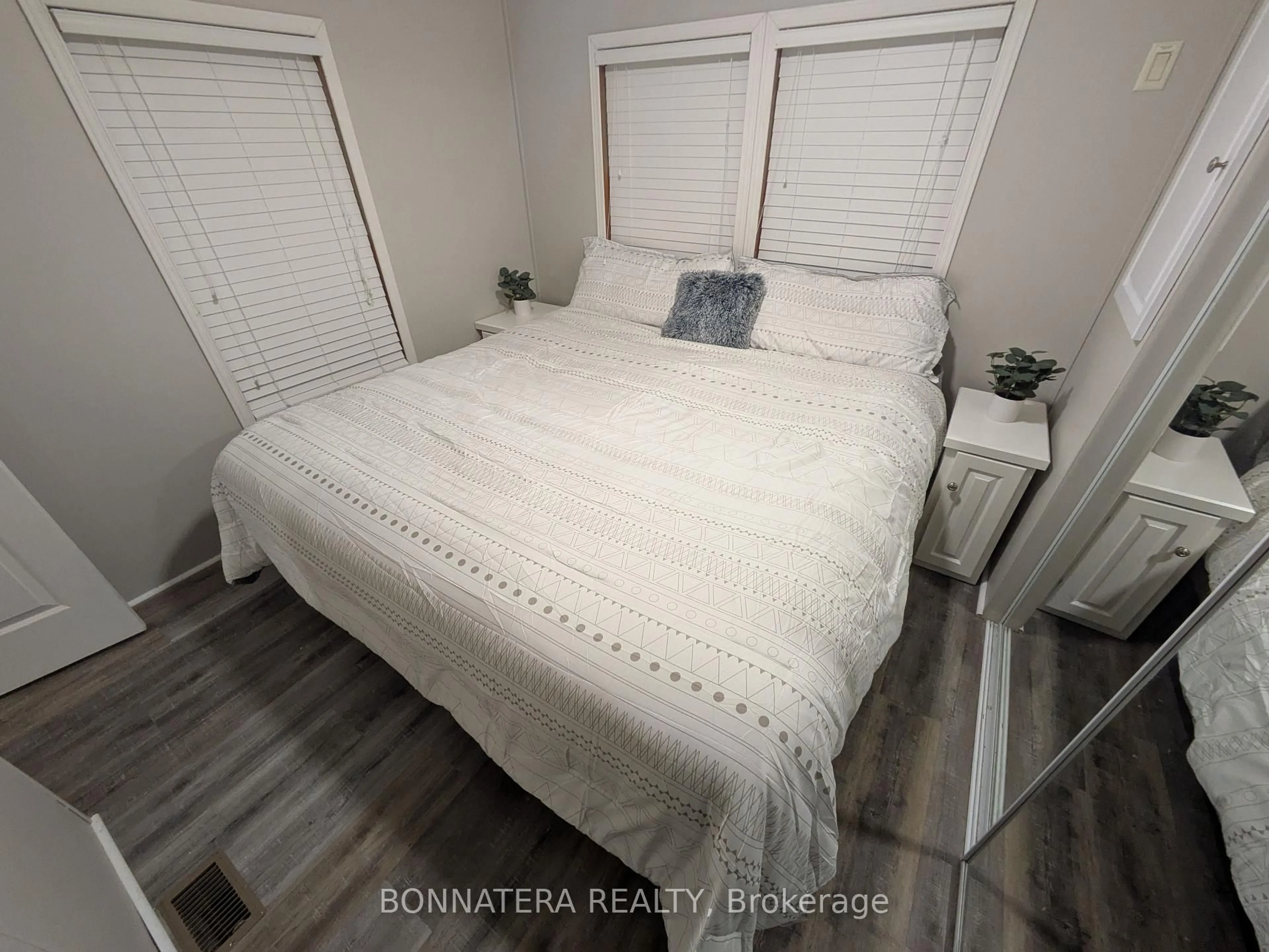Bedroom with bed, wood/laminate floor for 51 Wyldewood Bch Rd, Port Colborne Ontario L0S 1R0
