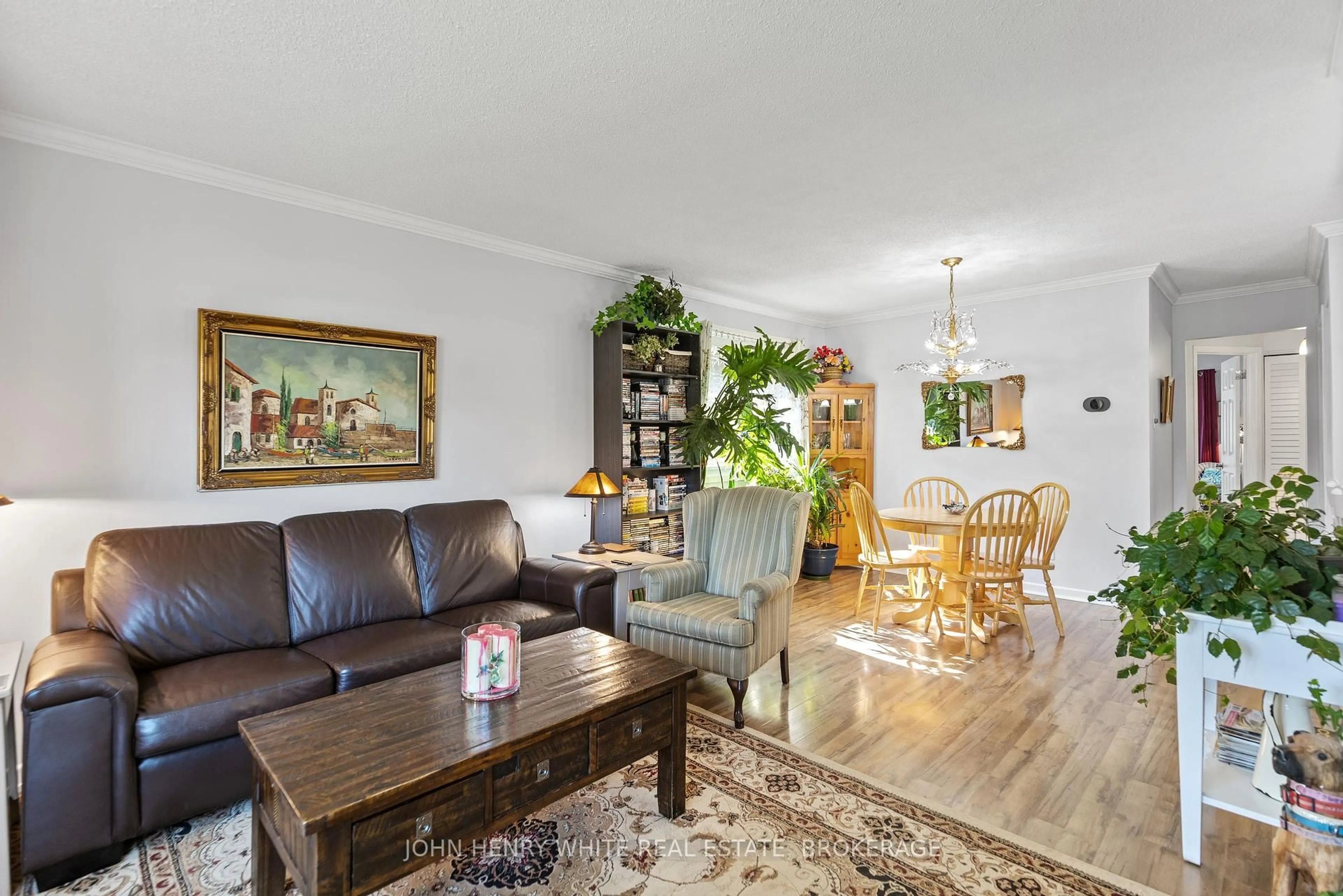 Living room with furniture, wood/laminate floor for 1182 Queensland Pl, Brockville Ontario K6V 6A7
