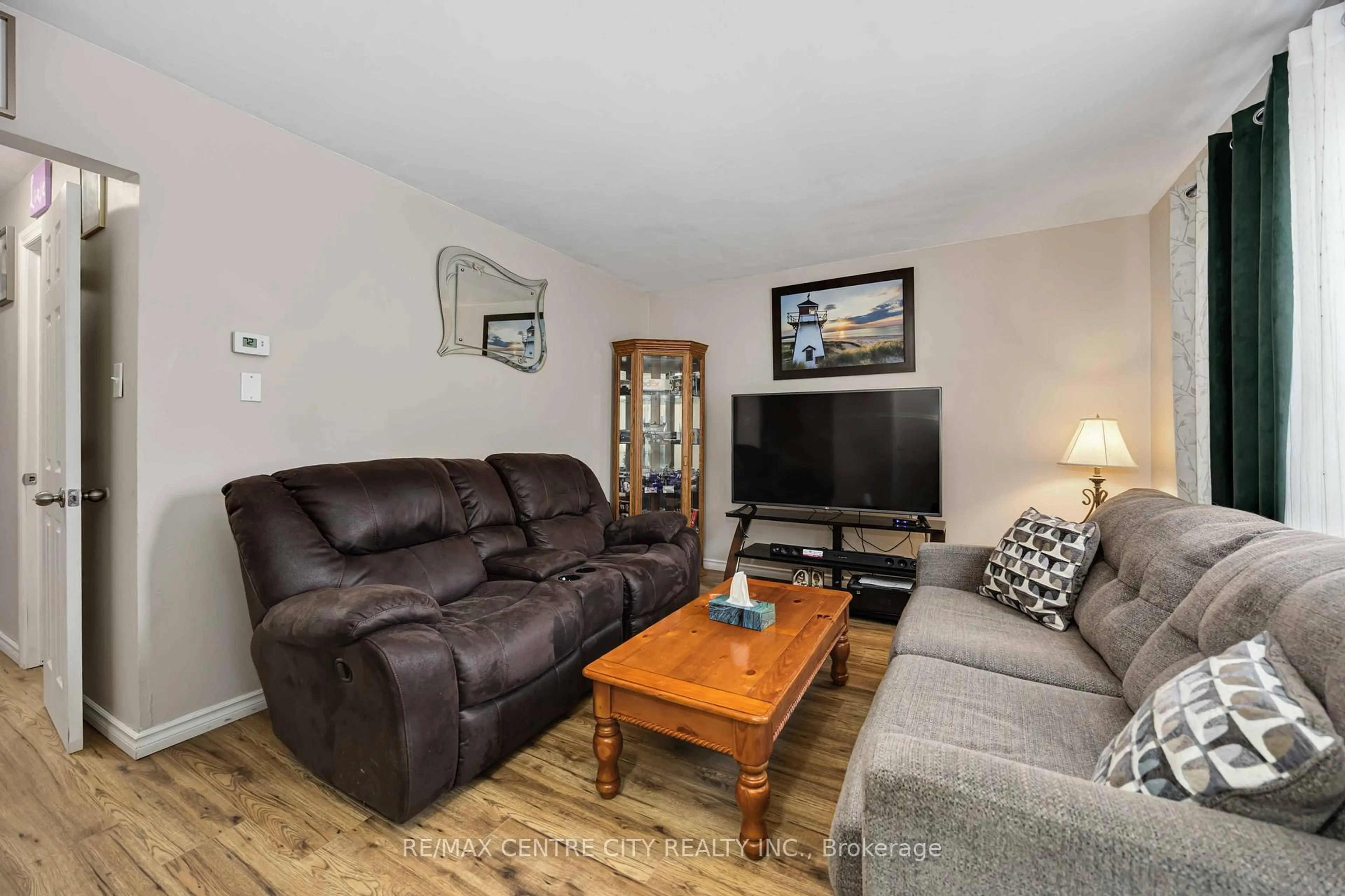 Living room with furniture, wood/laminate floor for 348 Cameron St #81, St. Clair Ontario N0N 1G0