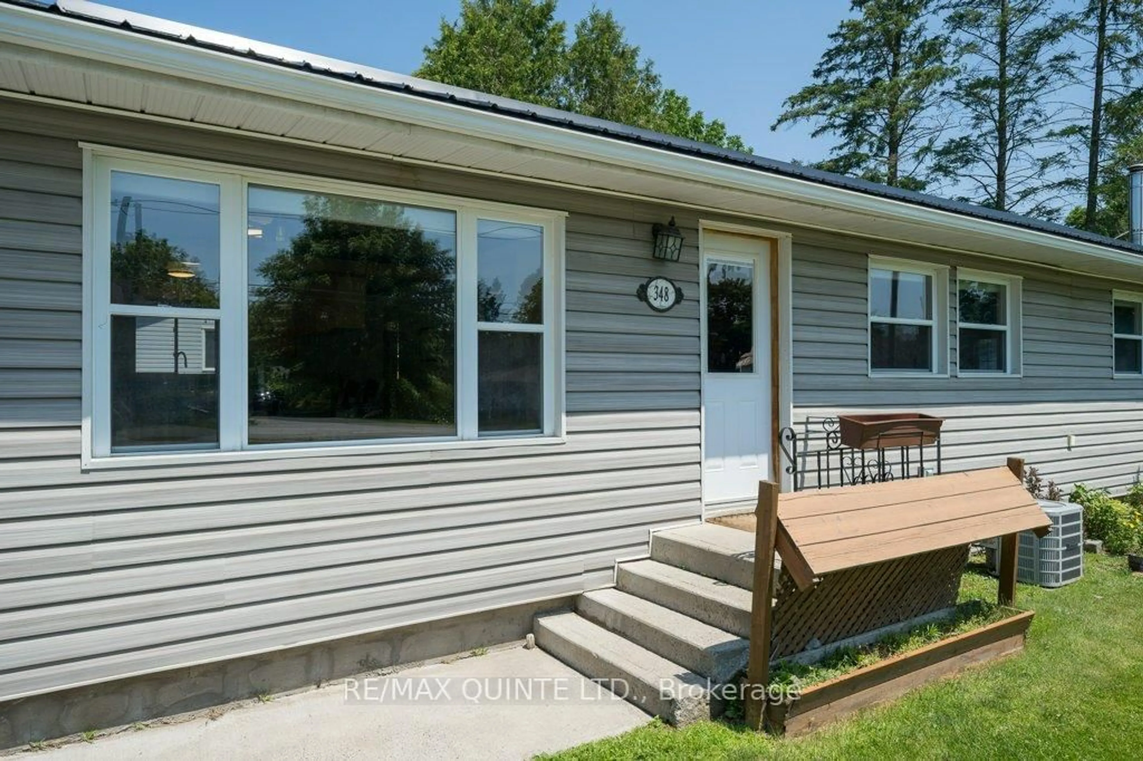 Home with vinyl exterior material, street for 348 River St, Tweed Ontario K0K 3J0