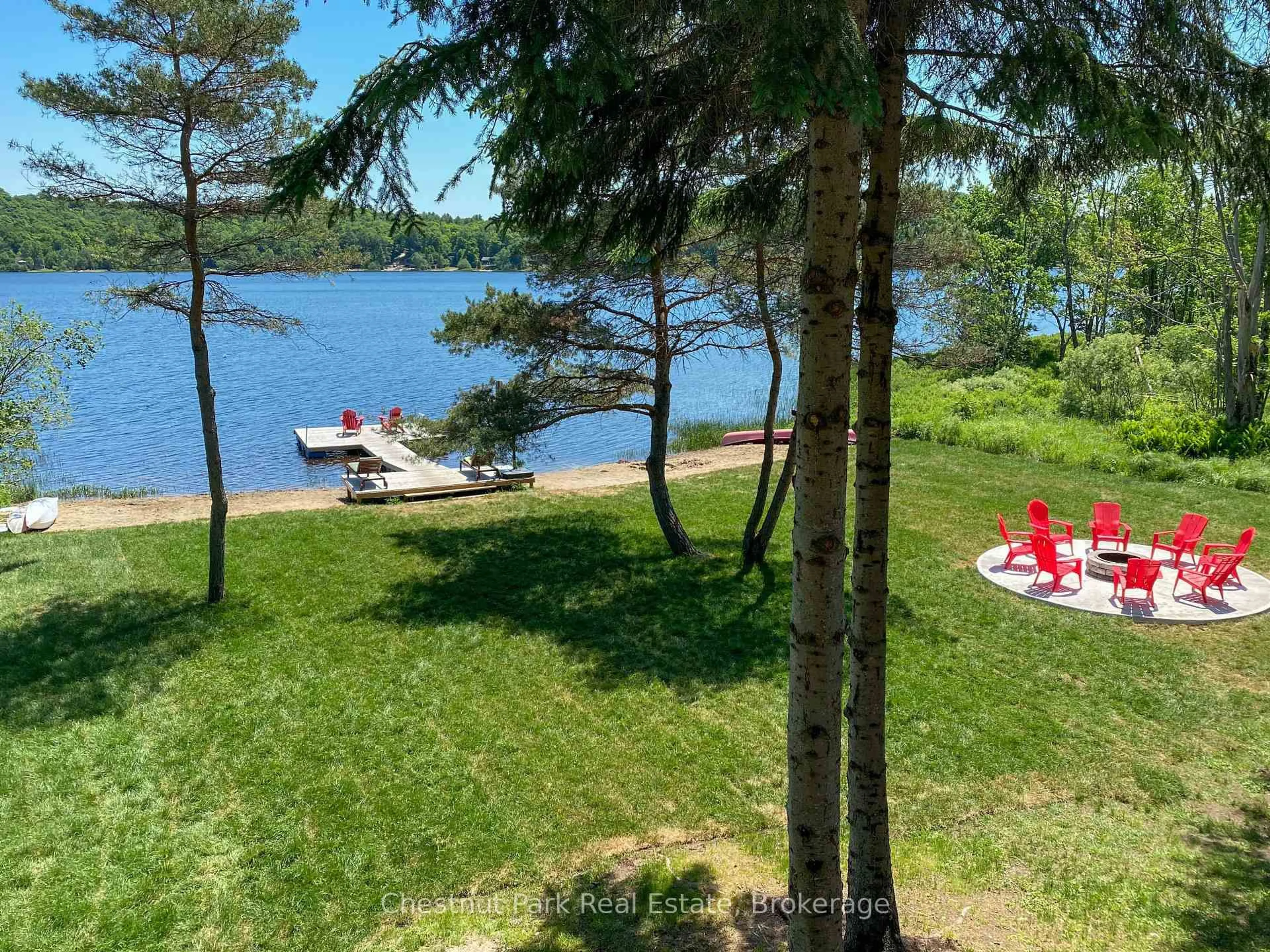 A pic from outside/outdoor area/front of a property/back of a property/a pic from drone, water/lake/river/ocean view for 121 North Deer Lake Rd, Huntsville Ontario P0B 1L0