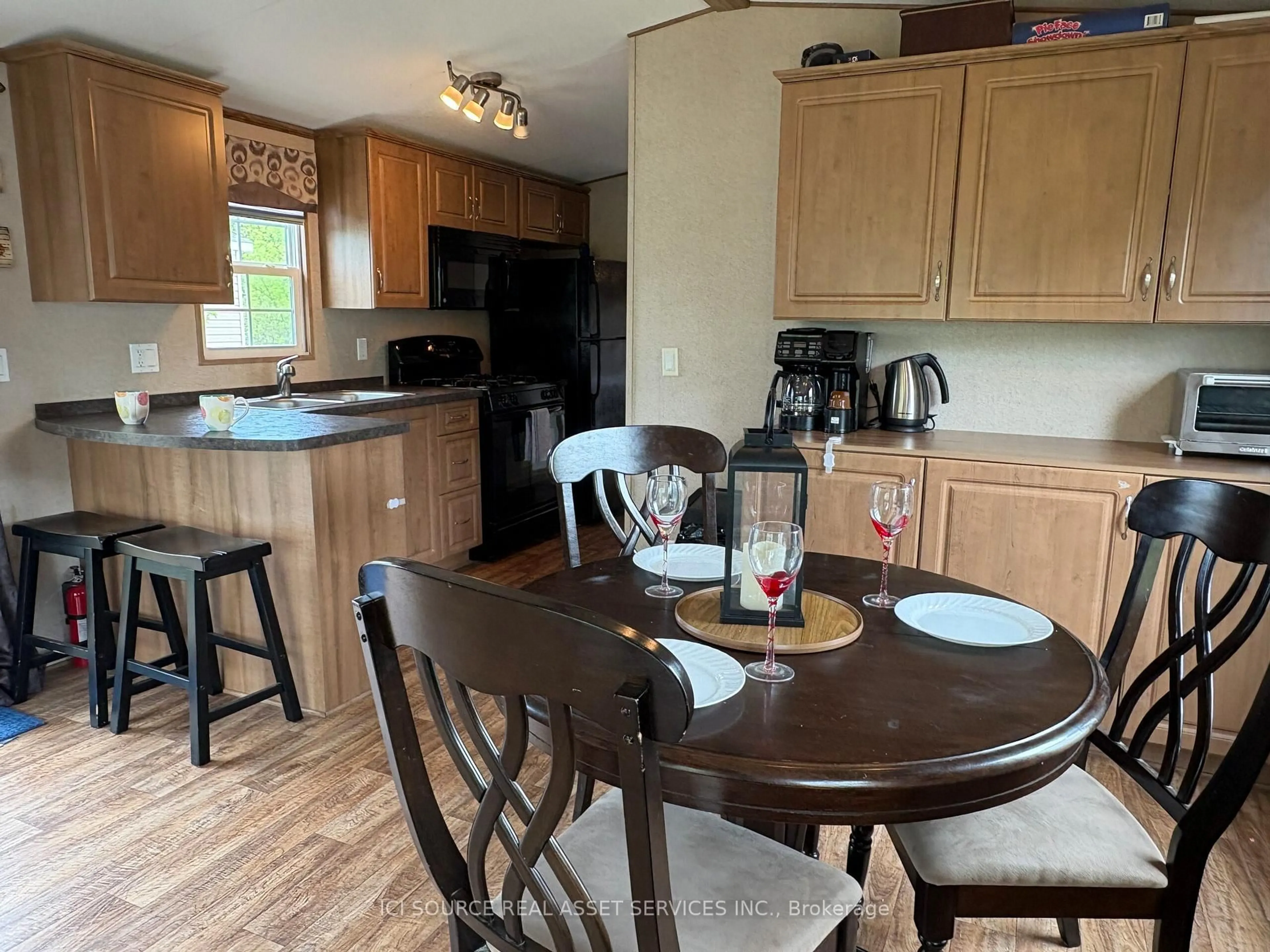 Open concept kitchen, wood/laminate floor for 1235 Villiers Line #GDFR013, Otonabee-South Monaghan Ontario K0L 2G0