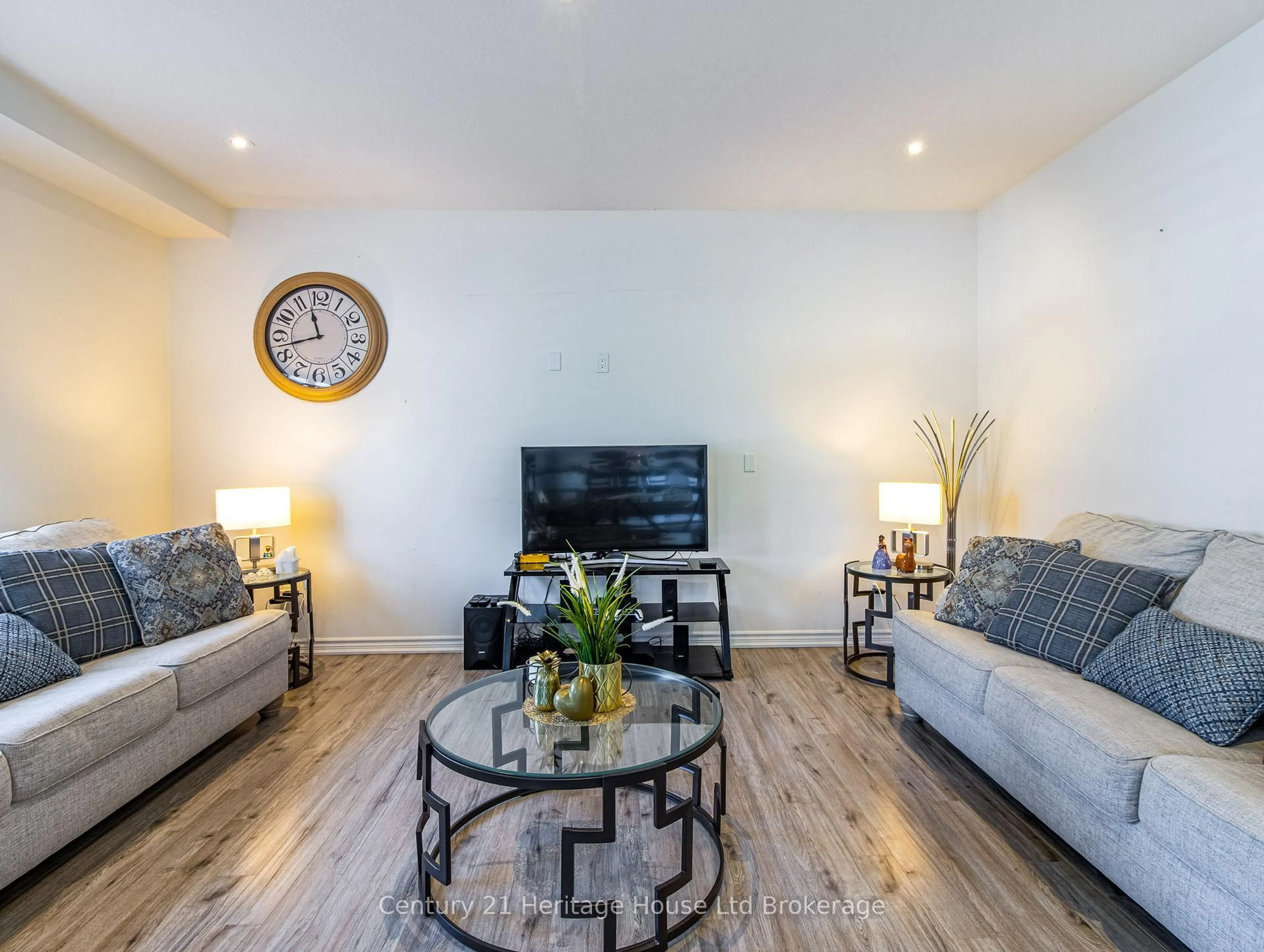 Living room with furniture, wood/laminate floor for 11 Peterson St, Blandford-Blenheim Ontario N0J 1G0
