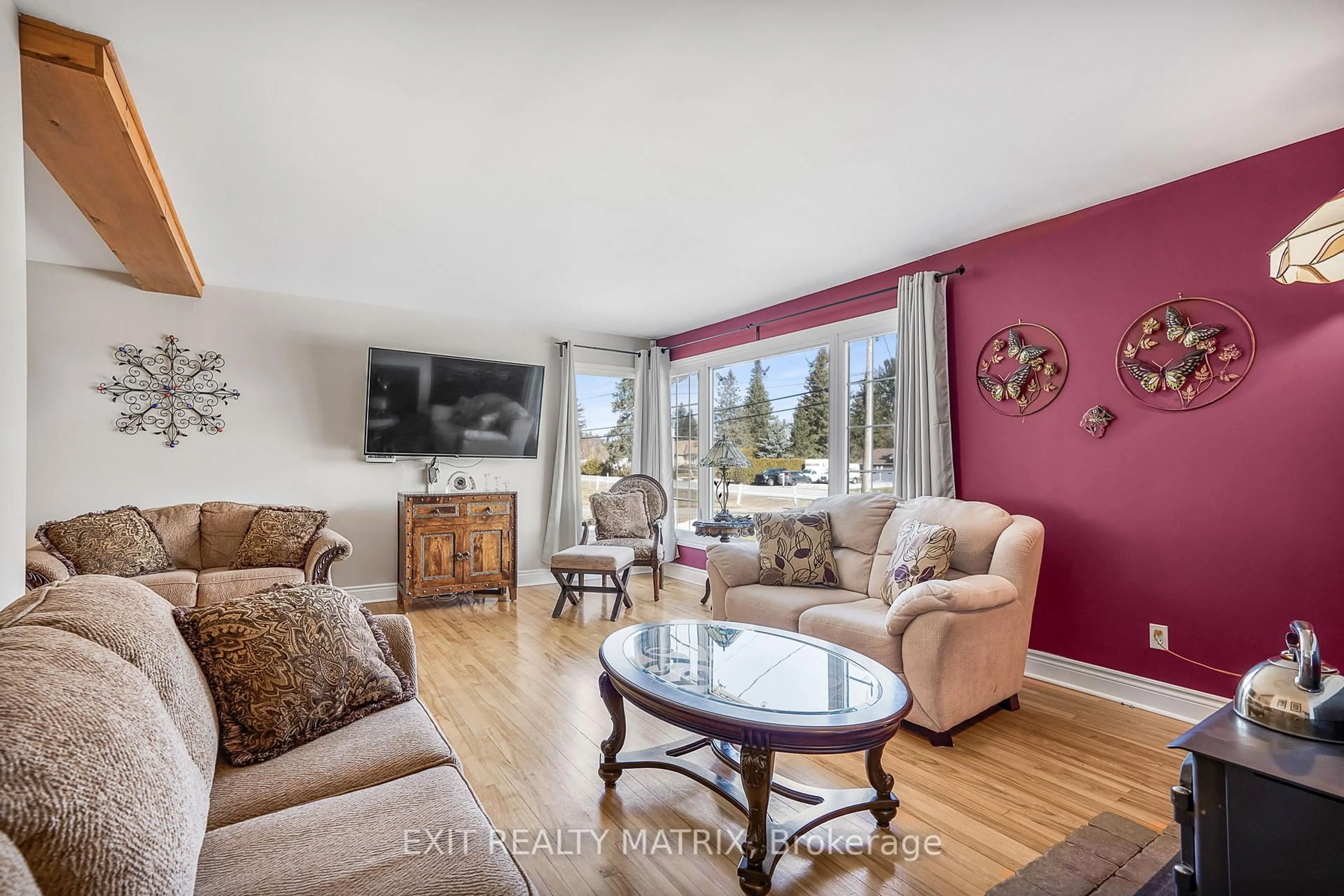 Living room with furniture, wood/laminate floor for 3756 Front Rd, Hawkesbury Ontario K6A 2T4