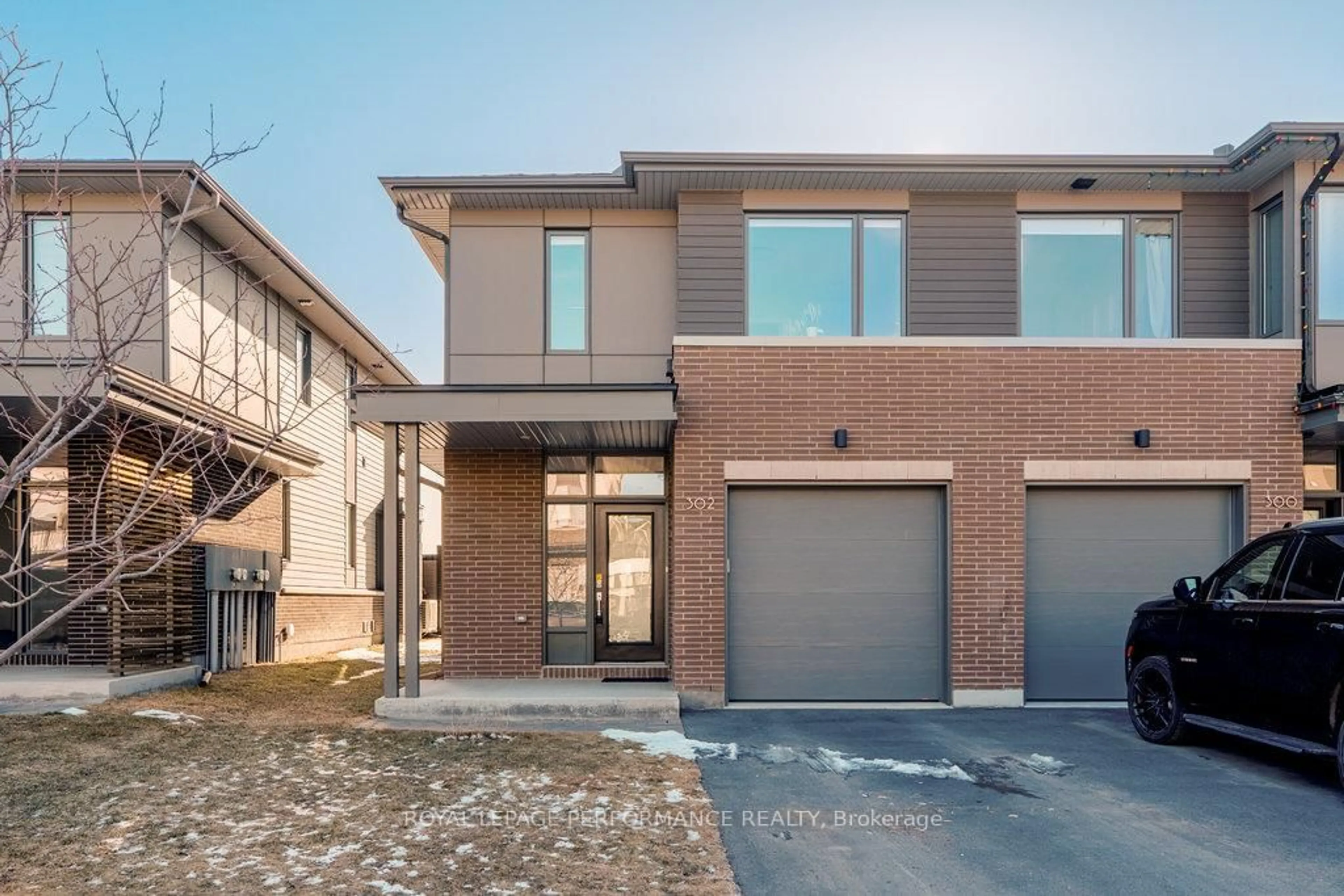 Home with brick exterior material, street for 302 Squadron Cres, Ottawa Ontario K1K 4Z4