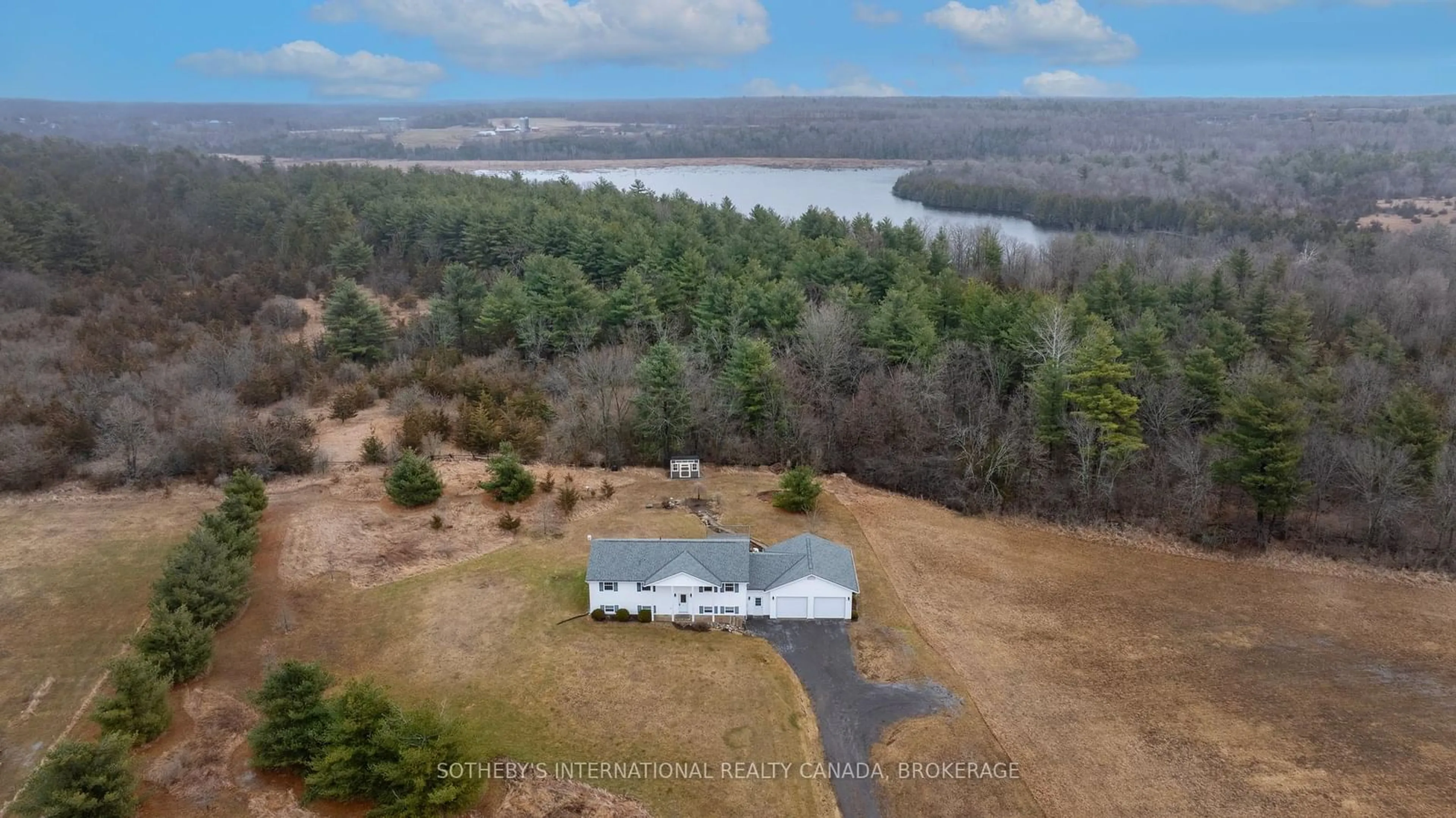 A pic from outside/outdoor area/front of a property/back of a property/a pic from drone, water/lake/river/ocean view for 4080 Mclean Rd, Harrowsmith Ontario K0H 1V0