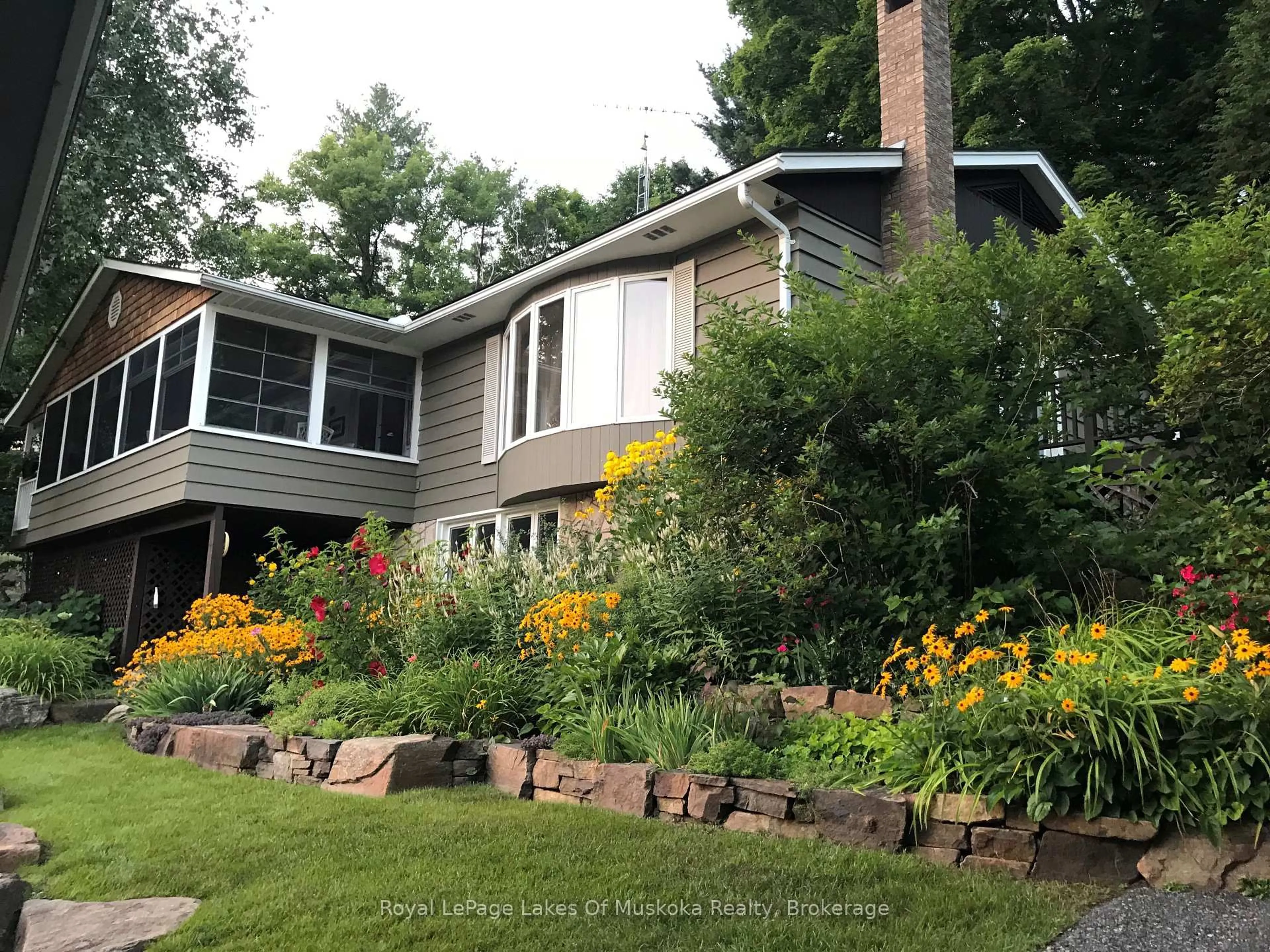 Home with vinyl exterior material, street for 1027 Old Bridge Rd #4, Muskoka Lakes Ontario P0B 1J0
