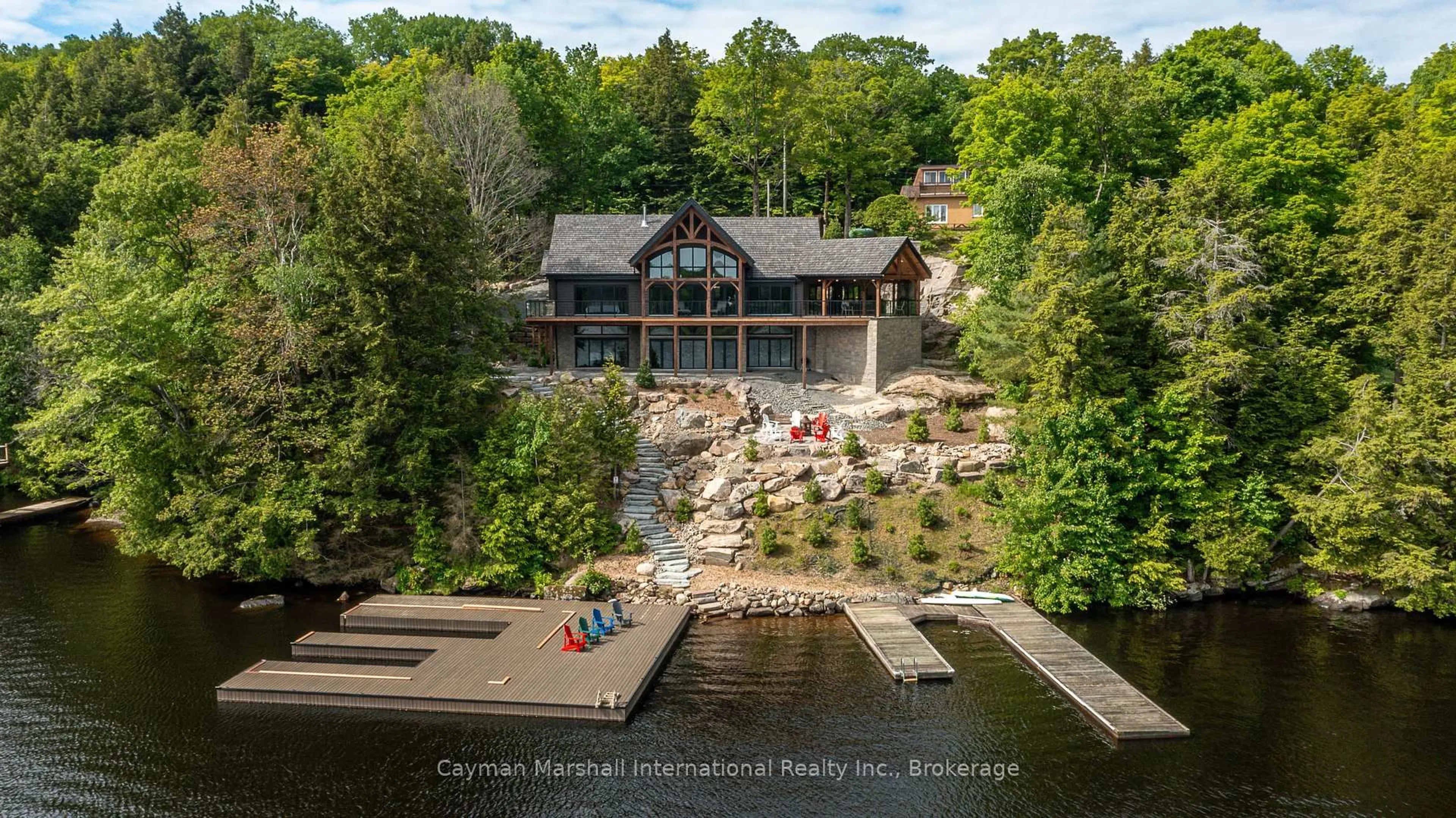 A pic from outside/outdoor area/front of a property/back of a property/a pic from drone, water/lake/river/ocean view for 1668 Beaumont Dr, Bracebridge Ontario P1L 1X2