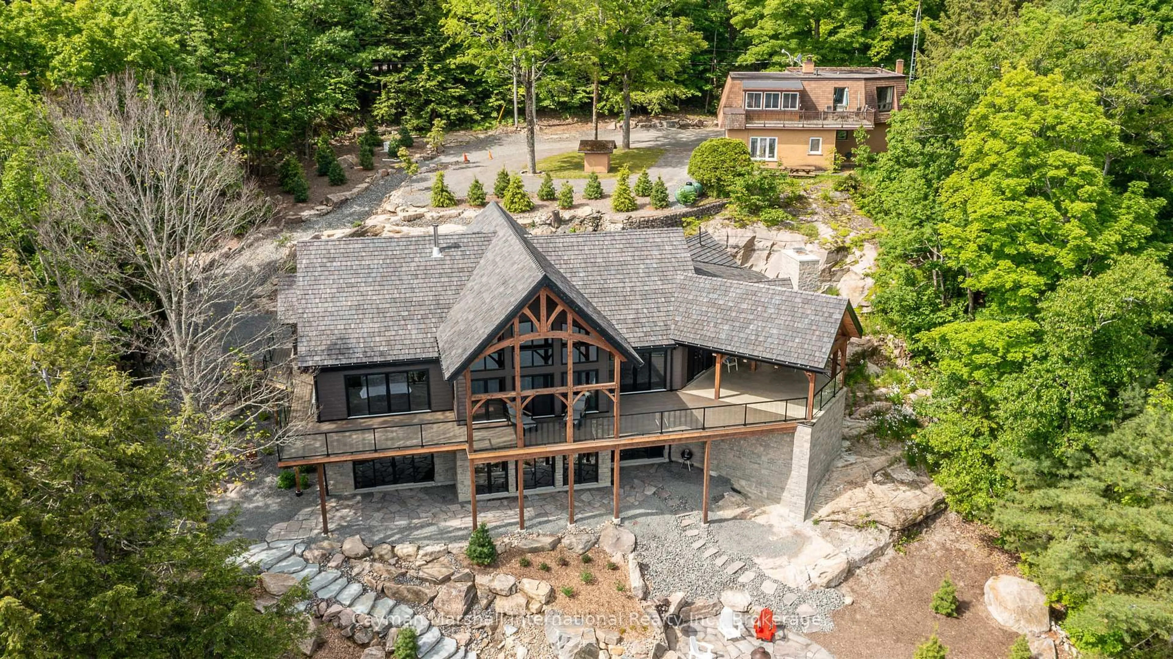 A pic from outside/outdoor area/front of a property/back of a property/a pic from drone, water/lake/river/ocean view for 1668 Beaumont Dr, Bracebridge Ontario P1L 1X2