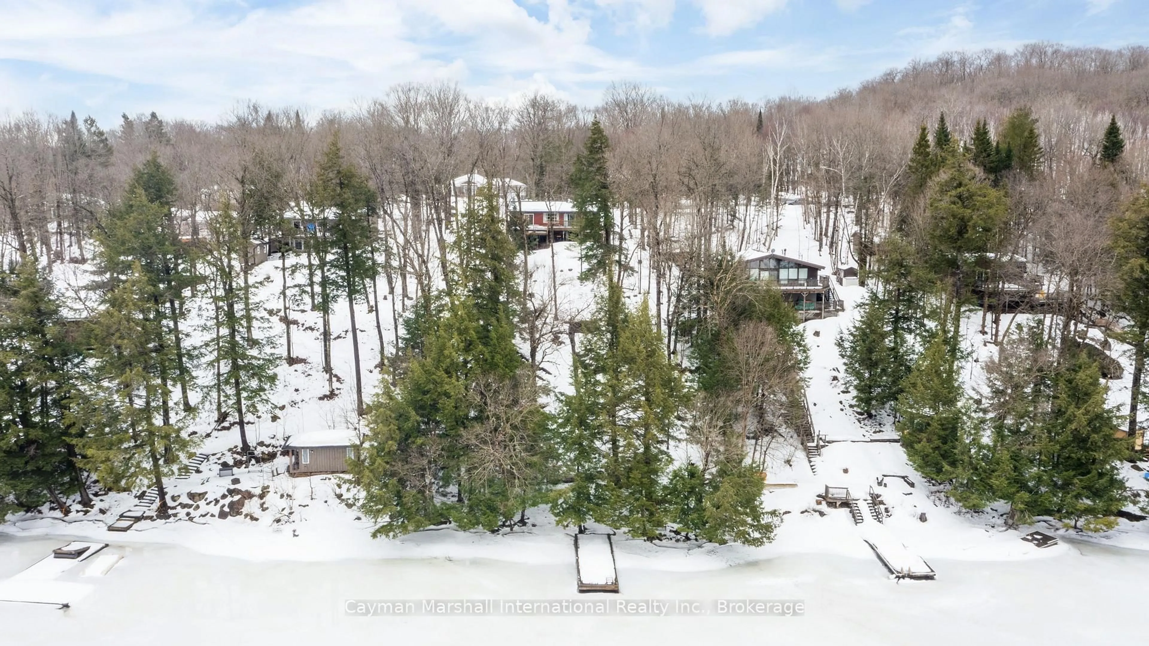 A pic from outside/outdoor area/front of a property/back of a property/a pic from drone, forest/trees view for 316 North Dr, Huntsville Ontario P1H 2J2