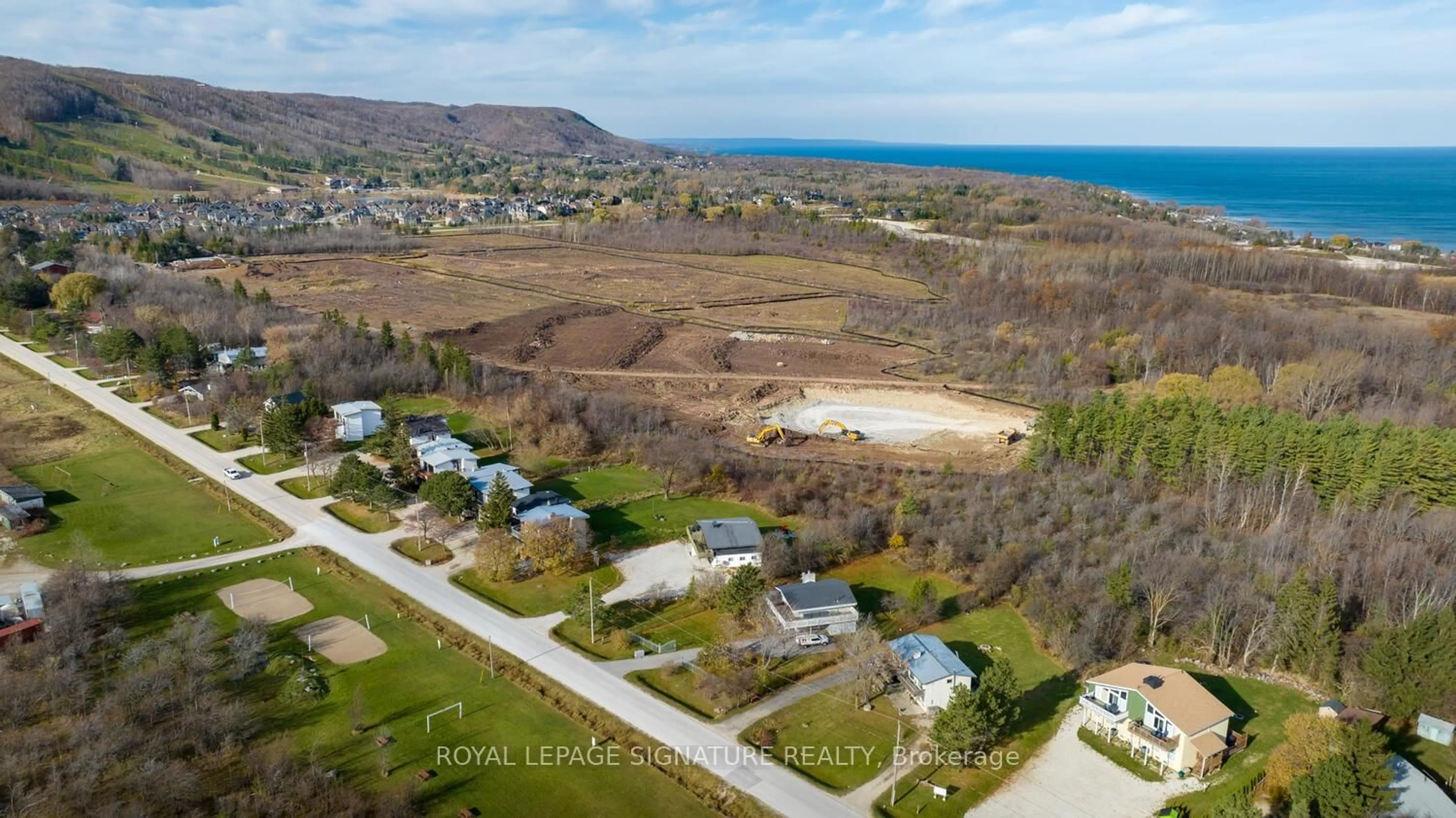 A pic from outside/outdoor area/front of a property/back of a property/a pic from drone, water/lake/river/ocean view for 163 Tyrolean Lane, Blue Mountains Ontario L9Y 3Z2