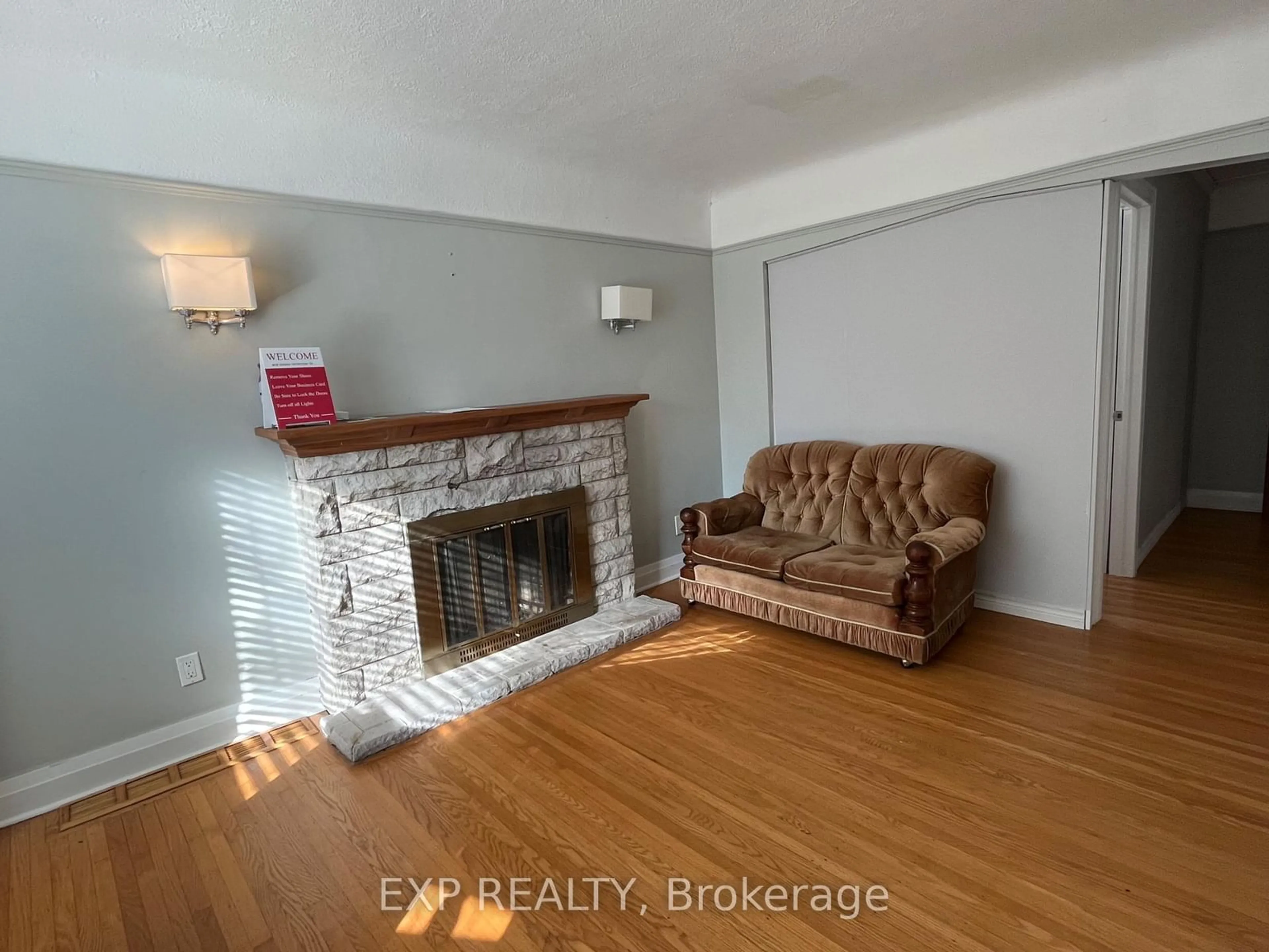 Living room with furniture, wood/laminate floor for 125 Haddon Ave, Hamilton Ontario L8S 1X7