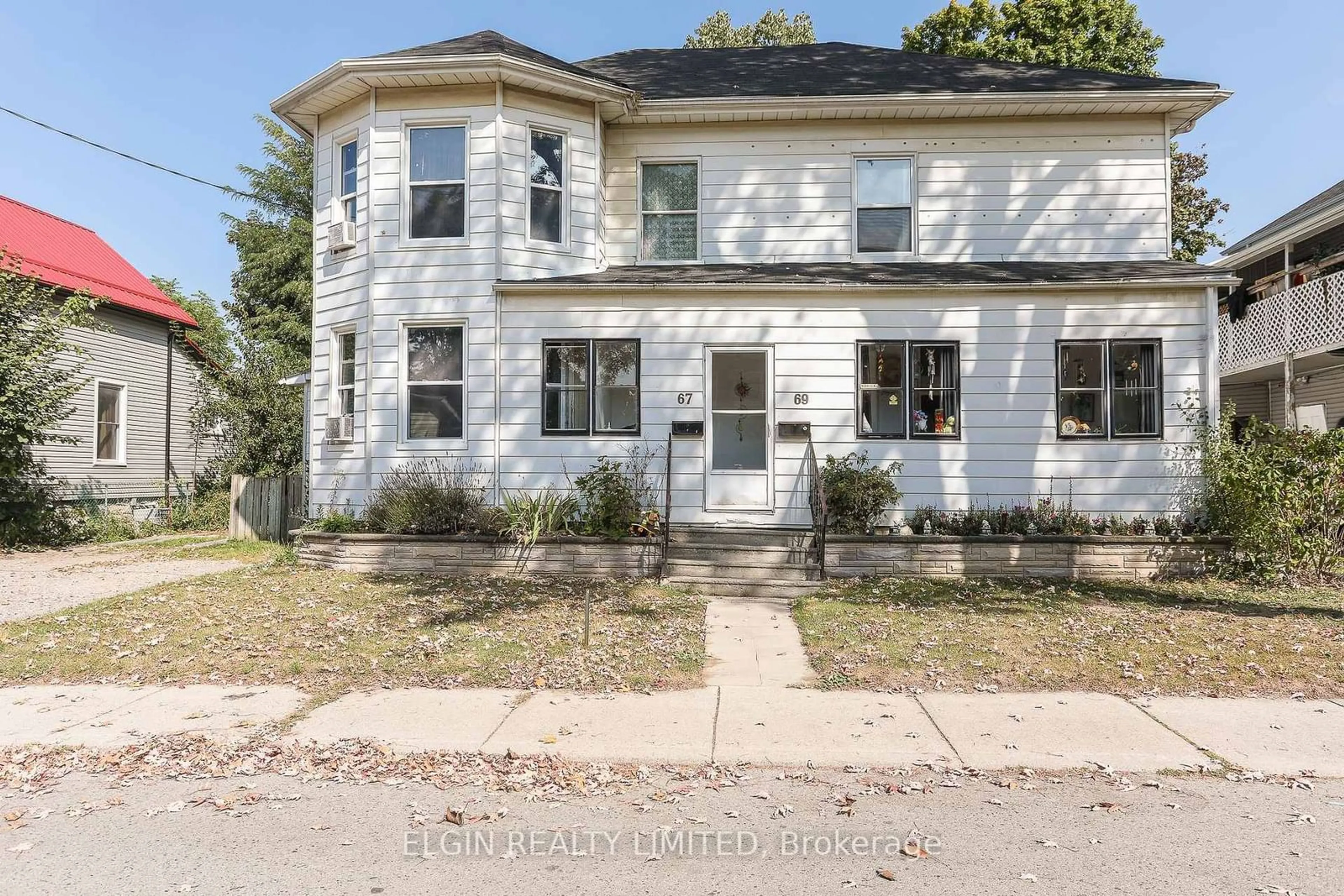 Home with brick exterior material, street for 67-69 Elizabeth St, St. Thomas Ontario N5R 2X3