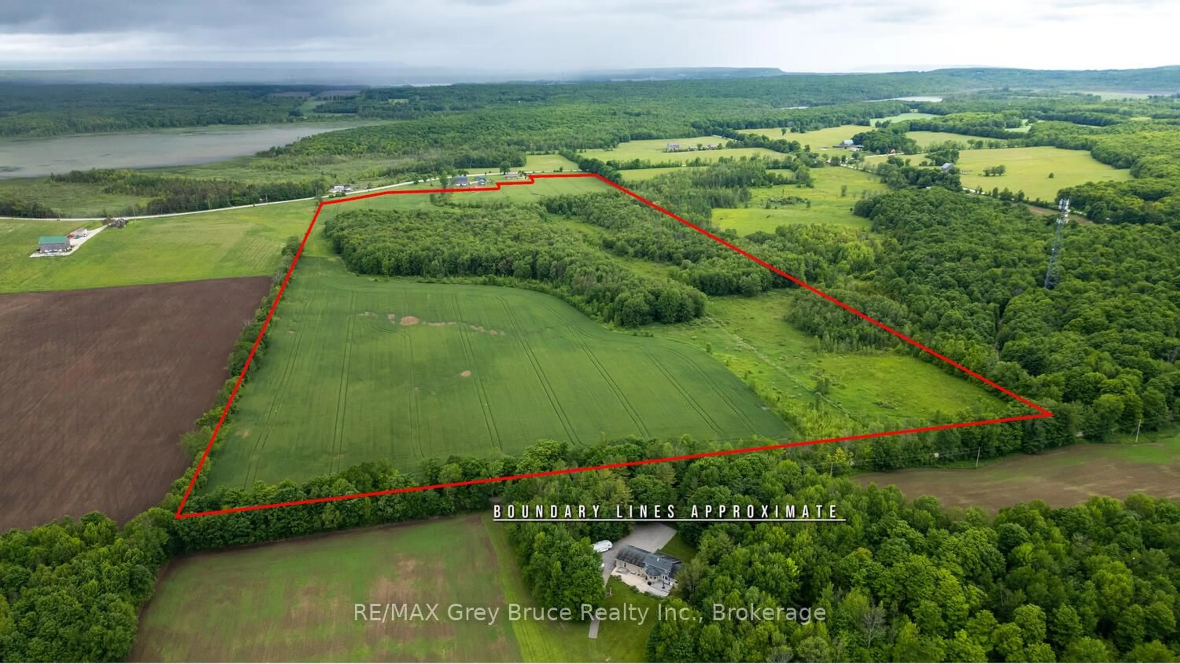 A pic from outside/outdoor area/front of a property/back of a property/a pic from drone, water/lake/river/ocean view for 402622 Grey 17 Rd, Georgian Bluffs Ontario N0H 2T0