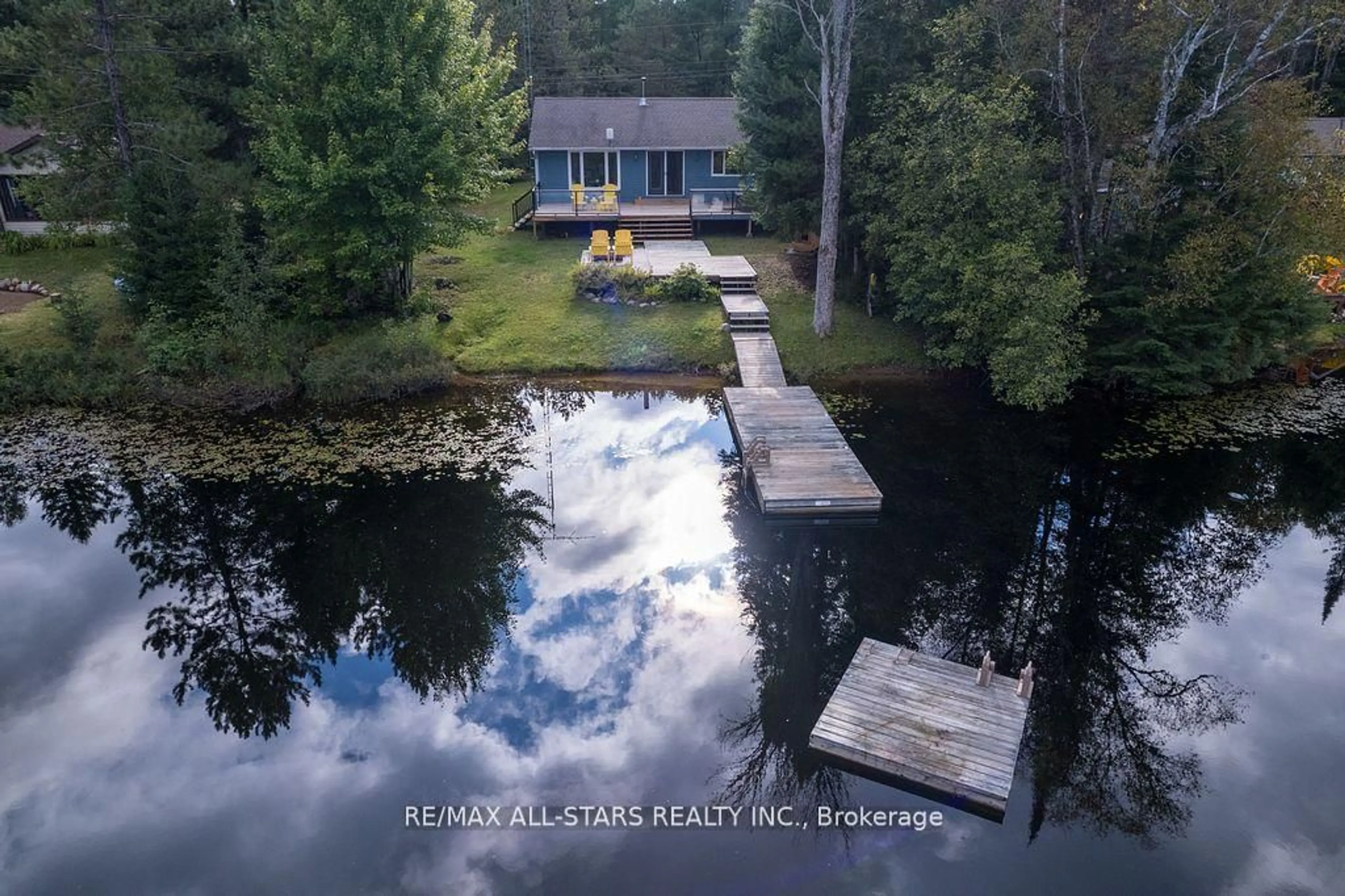 A pic from outside/outdoor area/front of a property/back of a property/a pic from drone, water/lake/river/ocean view for 1086 Cameron Lane, Algonquin Highlands Ontario K0M 1J0