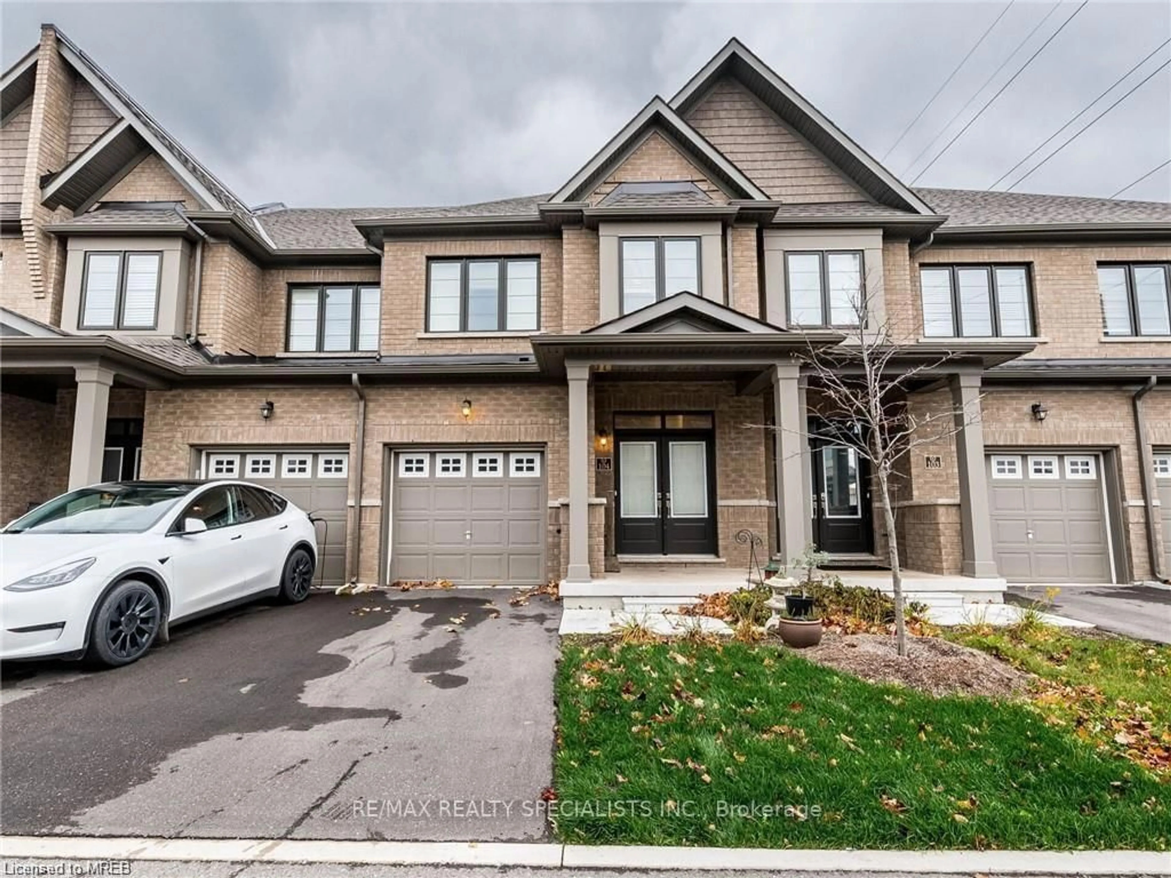 Home with brick exterior material, street for 166 Deerpath Dr #104, Guelph Ontario N1K 0E2